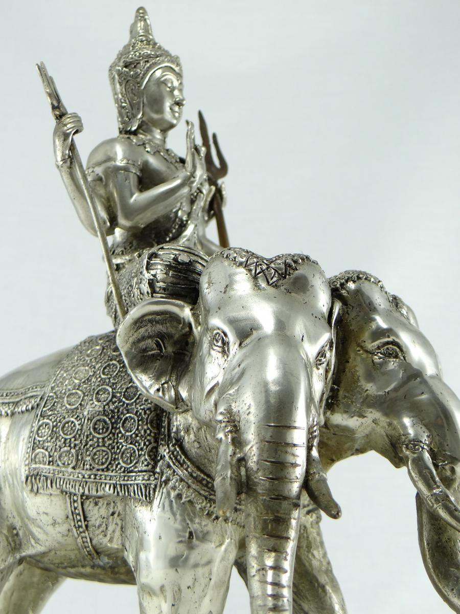 Silver bronze sculpture depicting the god Indra, god of heaven, lightning and rain bringing fertility with the water it brings to earth. He is perched on his mount Airatava, the white elephant with three heads, king of celestial elephants. Very fine