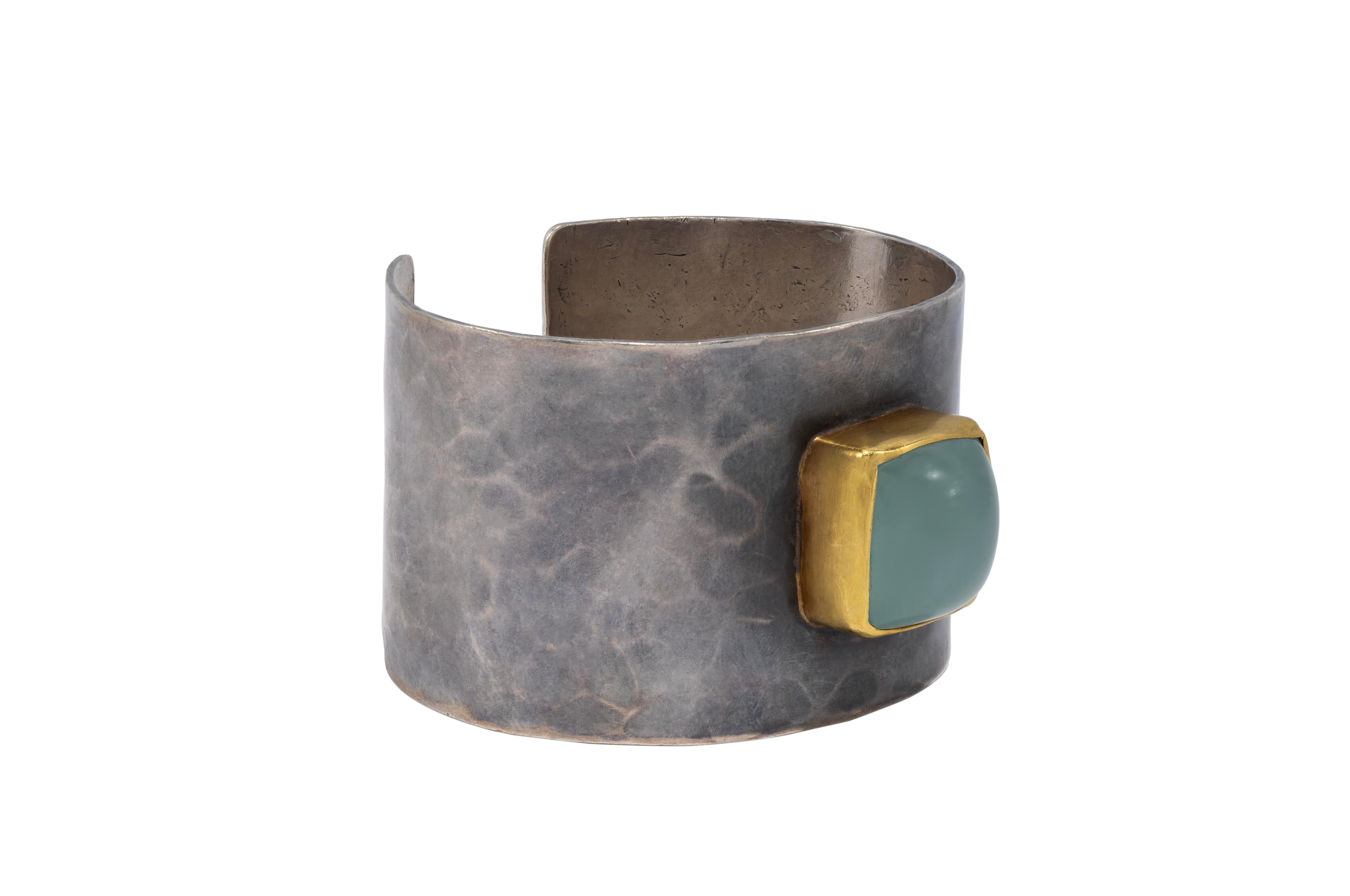 Sterling silver Goddess Cuff, blackened, hammered and distressed featuring a beautiful center Aqua stone set in 22k gold. Hand made, hand textured, one of a kind. Classic and sophisticated with a modern twist. Our goal is to feel powerful, beautiful