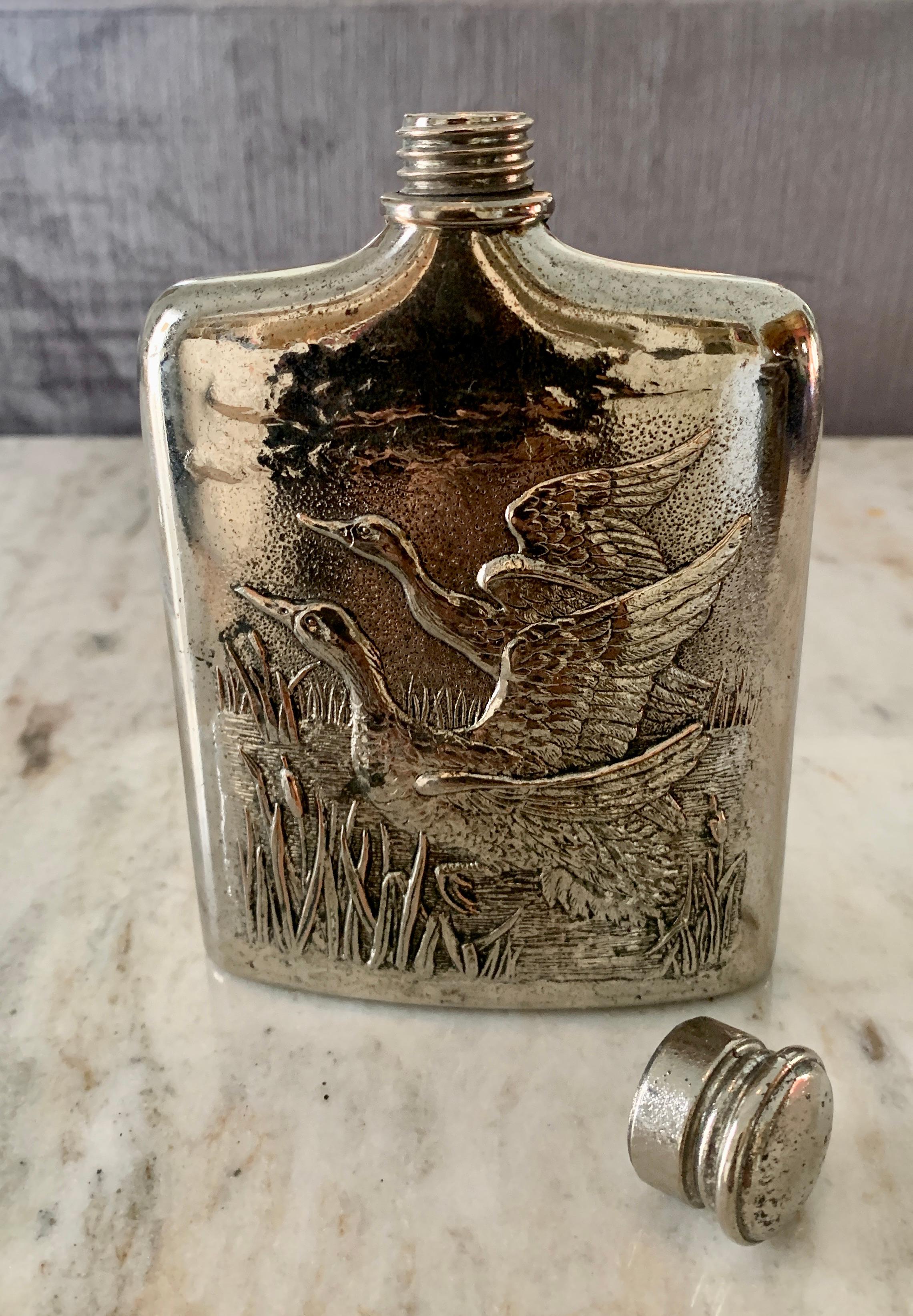 Godinger Flask with Reposse Geese and screw on Cap. The flask has been newly polished and is dated 1985. A wonderful decorative piece for the den or library, or for practical use
