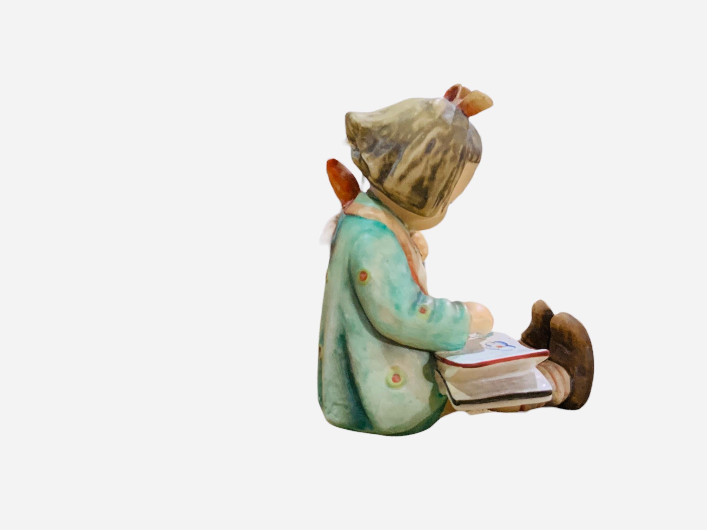 German Goebel Company Hummel Porcelain Figurine “Reading Girl”