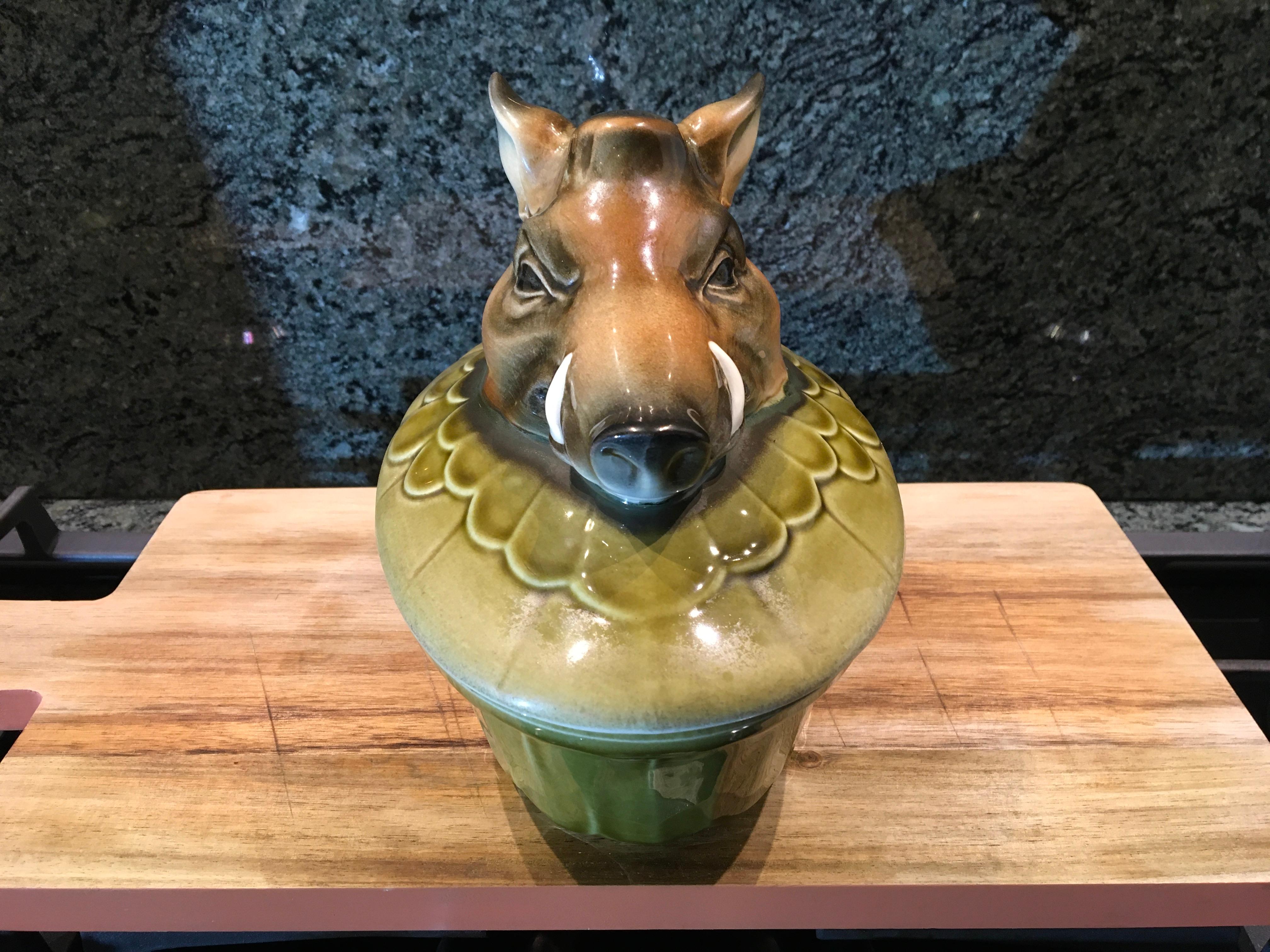 Terrine with wild boar by Goebel, W-Germany.
An oval green ceramic pate terrine with a wild boar on top. 
Dates from the 1980s. - stamped under Goebel W.Germany. 
This paté pot is in beautiful condition. 
The lid it a little mat on the edge and one