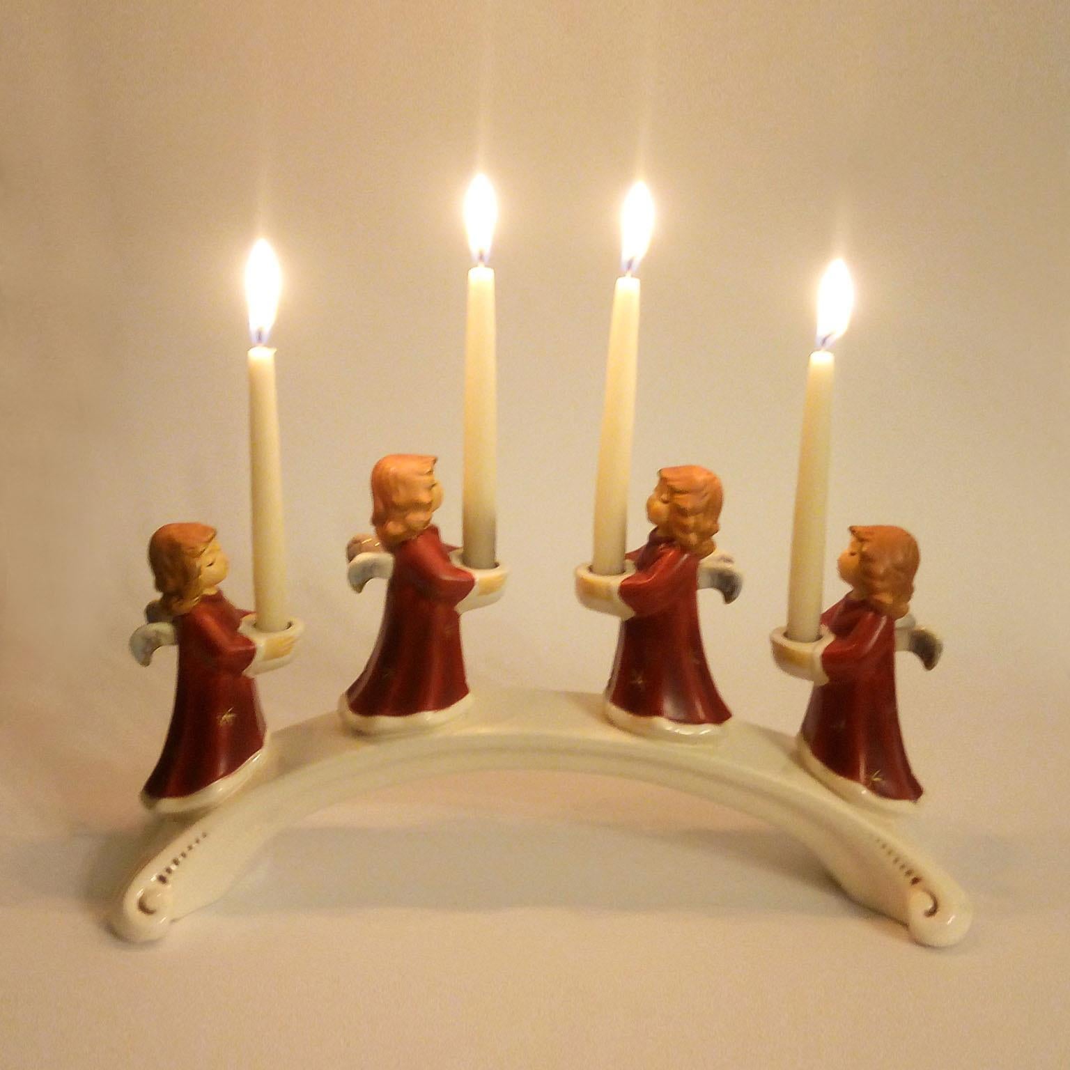 Goebel, West Germany. Advent candleholder with angels in porcelain. Dated 1971. An Advent candle holder bridge shaped with four angels.
It is in excellent, undamaged condition. The underside is marked with the maker's mark, impressed form number,