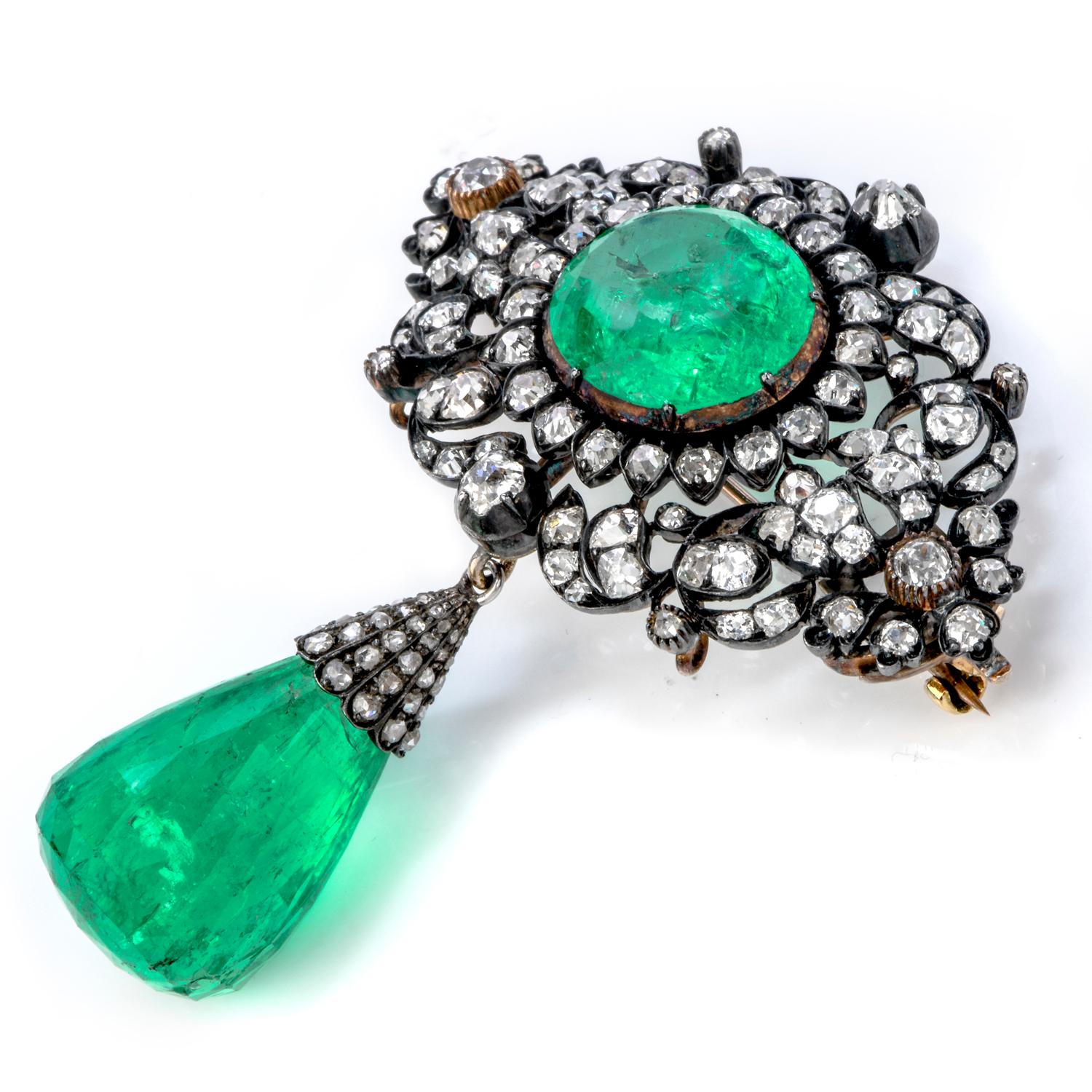 his antique Georgian Emerald Diamond Silver and Gold pendant is masterfully crafted in silver and gold, weighing 17.6 grams and measuring 47mm wide and 57 mm long.

This stunning and rare antique pendant is centered with a large oval-shaped genuine