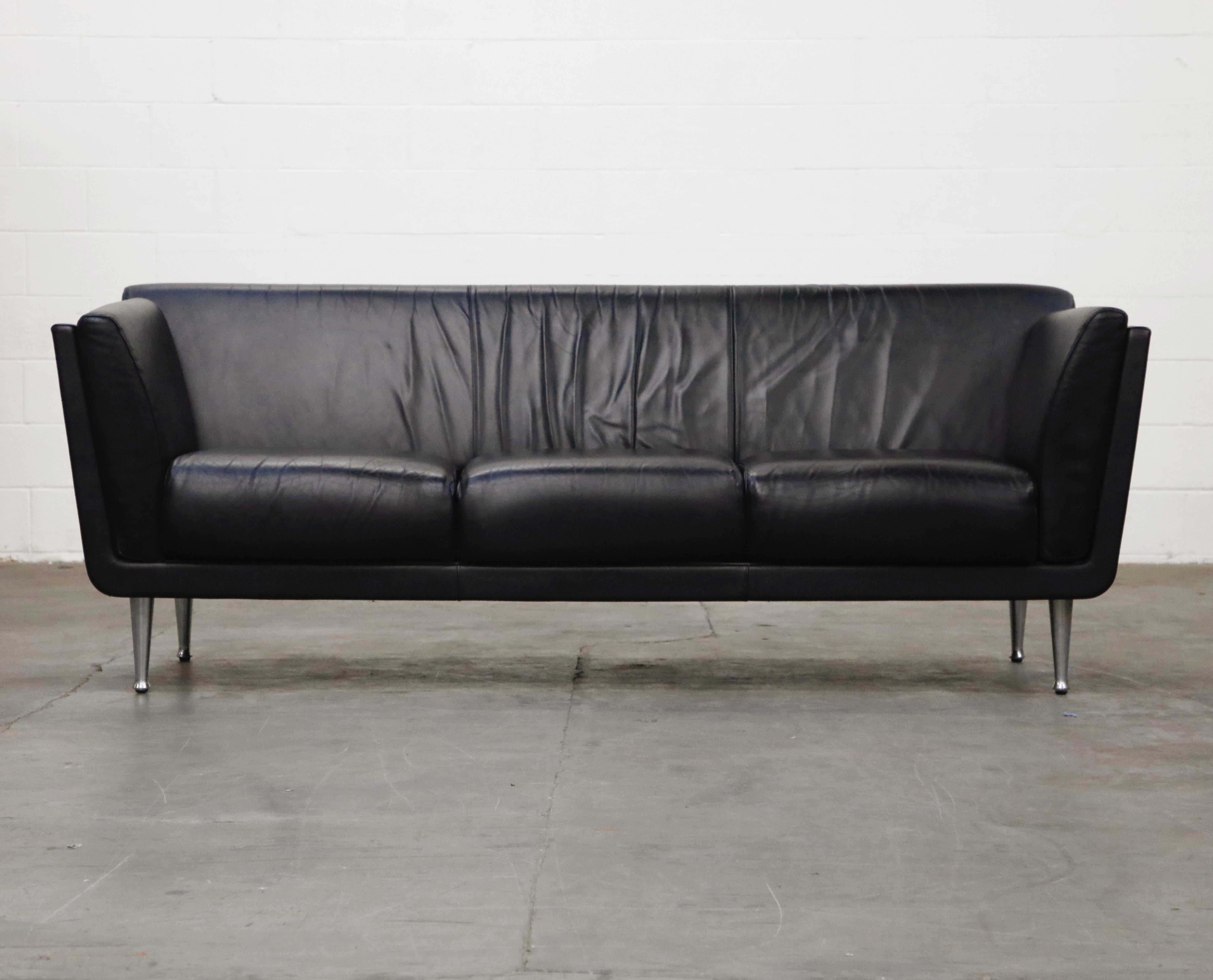 This incredible Goetz sofa by Mark Goetz for Herman Miller features a walnut case, quality black leather, and aluminum legs. Designed in 1998, this example produced in 2007, signed and dated with original Herman Miller labels. In very good condition