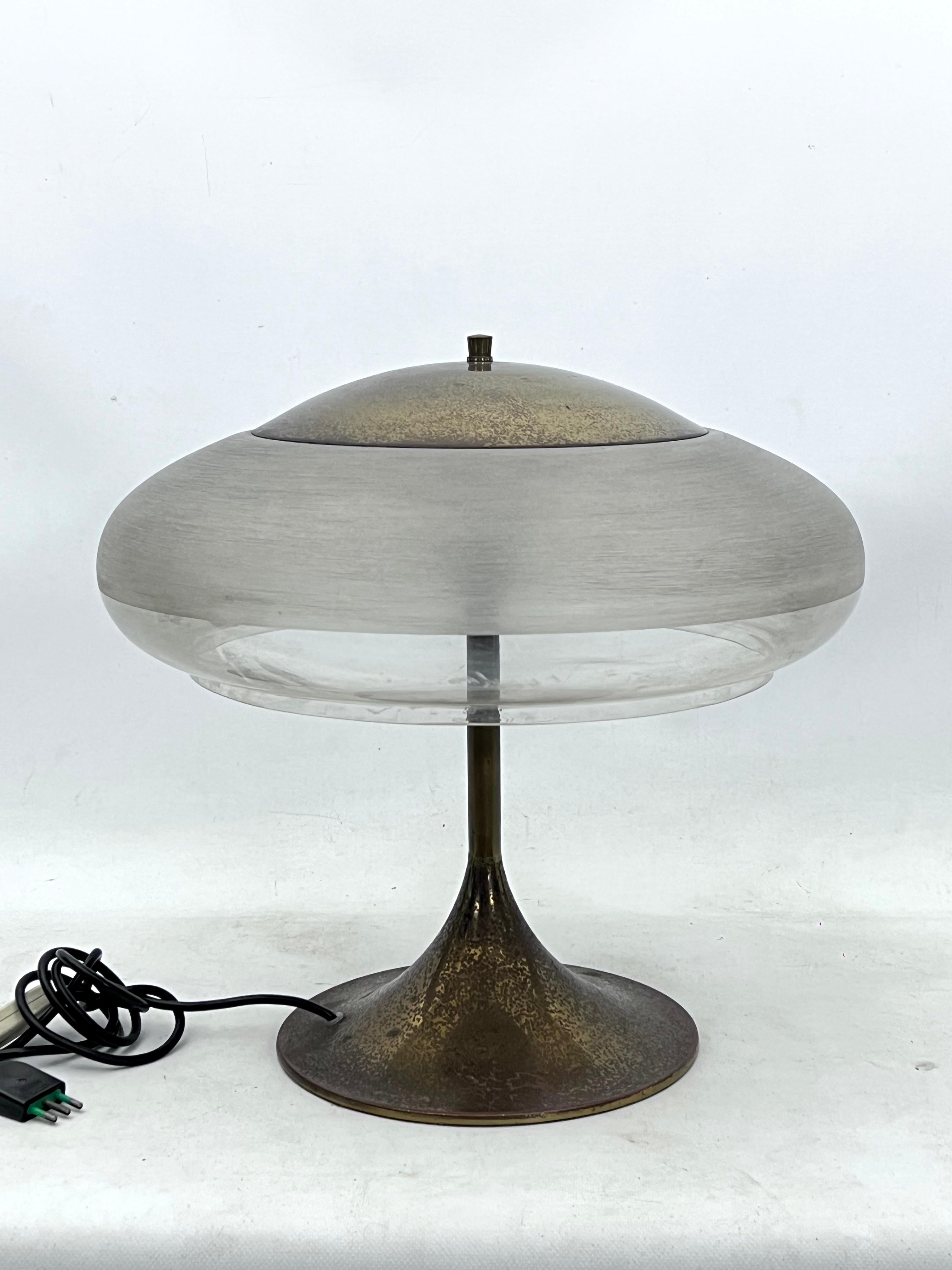 Brass and Acrylic shade table lamp produced in Italy during the 60s and designed by Goffredo Reggiani. Good vintage condition with trace of age and use, dots on the brass. Acrylic with no cracks.