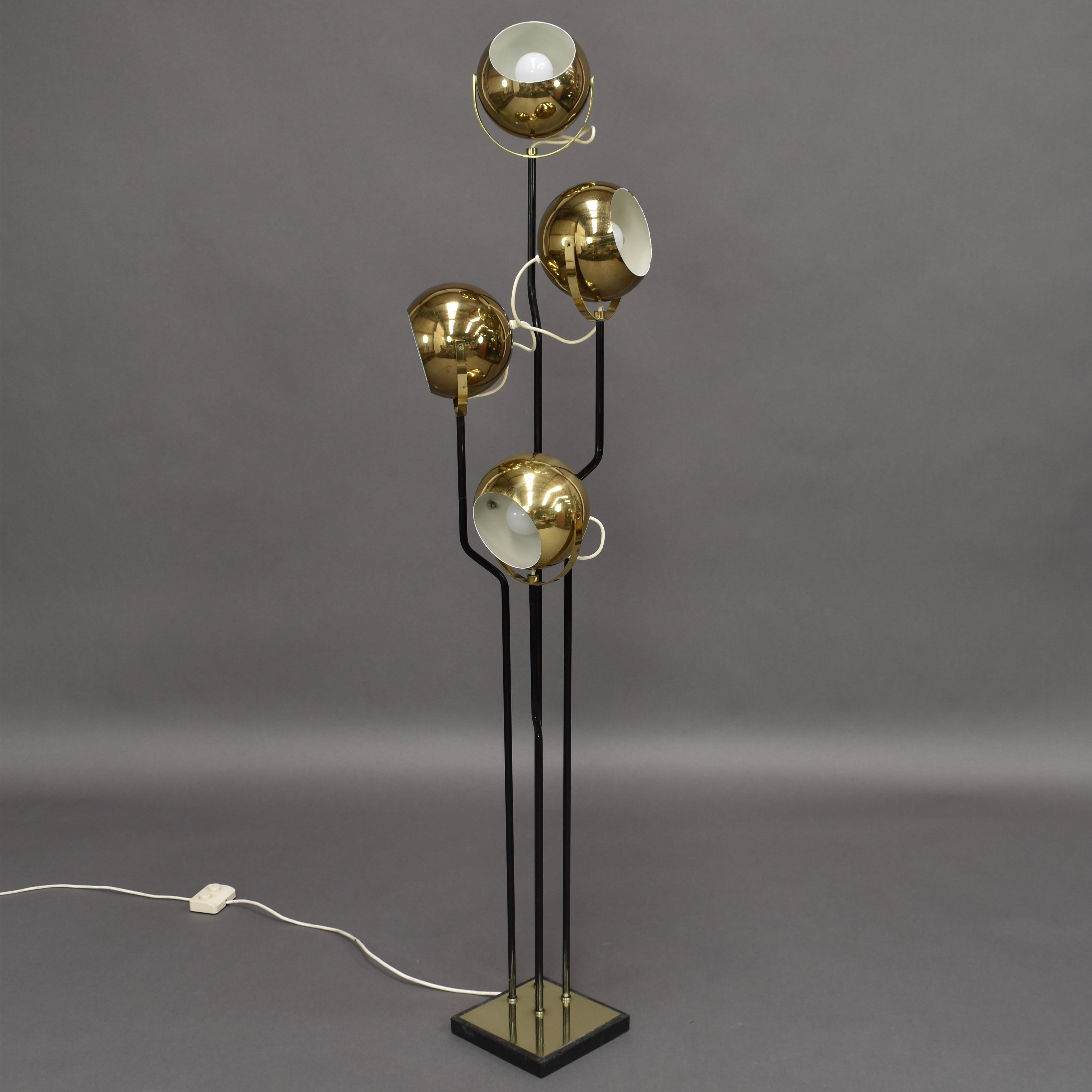 Stunning brass four-globe floor lamp by Goffredo Reggiani, Italy, 1970s. The two upper and the two lower spots can be lit separate from each other, or all four at the same time. Suitable for USA use. This is a rare model.

Designer: Goffredo