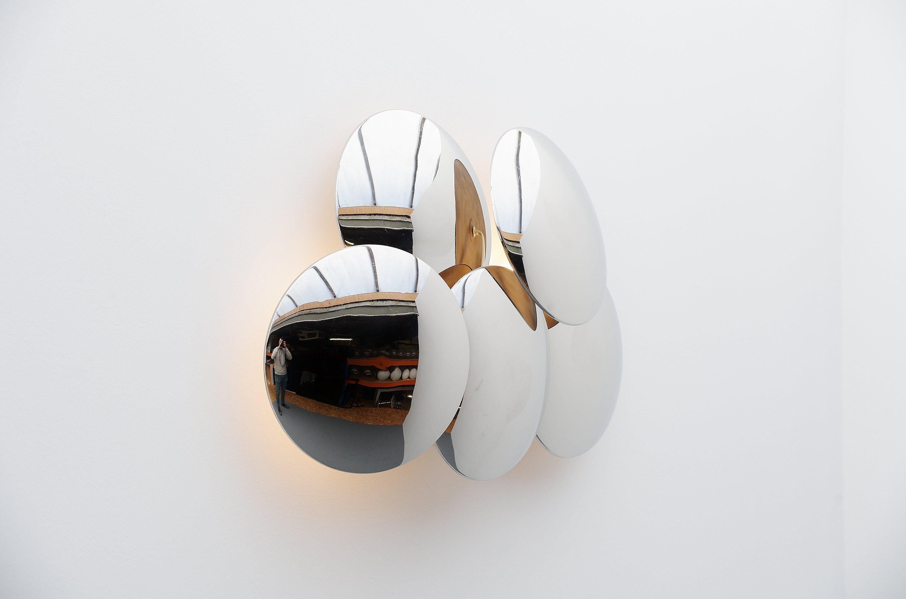 Spectacular large convex dis wall lamp designed by Goffredo Reggiani and manufactured by Studio Reggiani, Italy, 1970. This large wall lamp has a white painted metal structure with 5 large chrome-plated metal disc shades. The lamp gives very nice