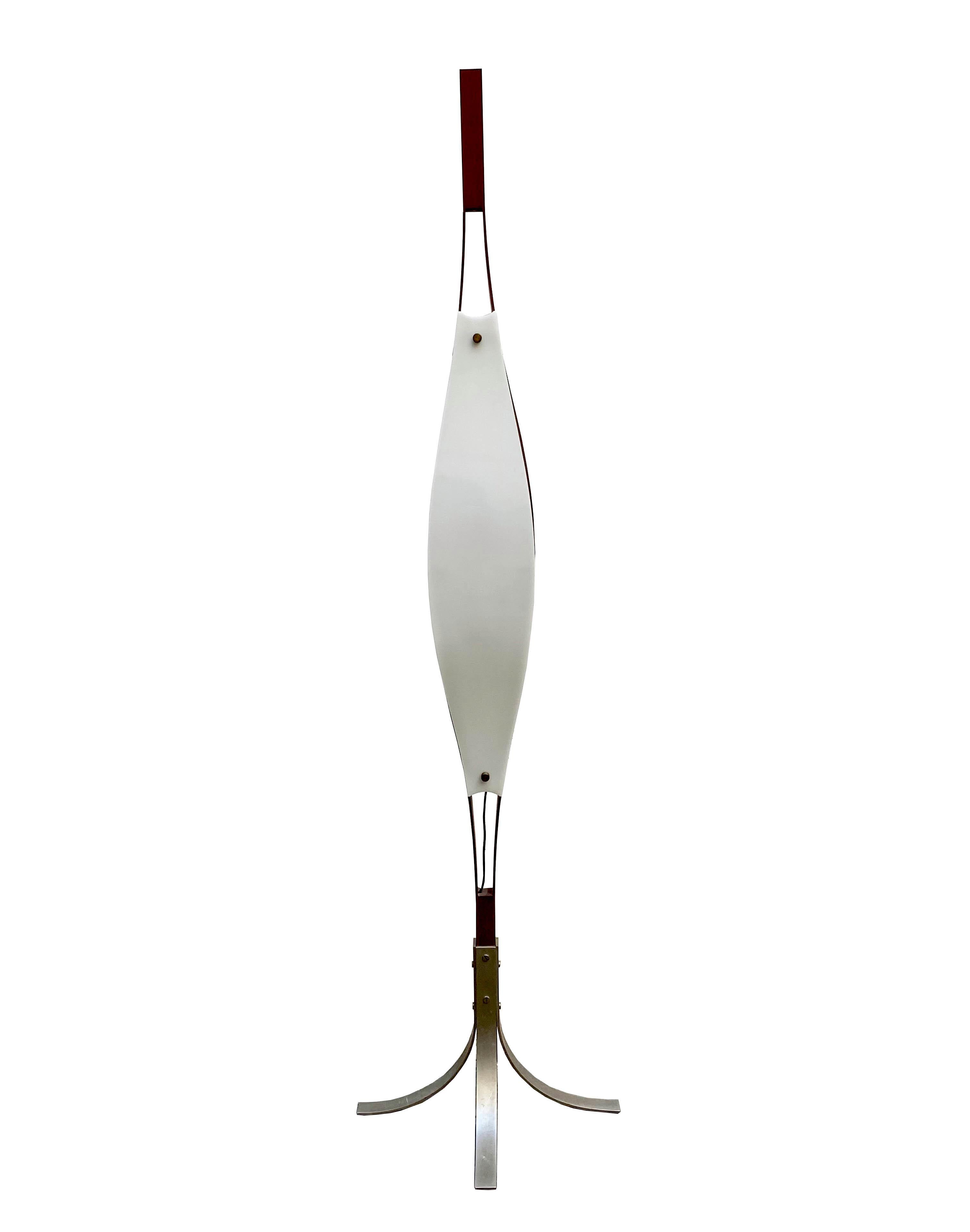 The Goffredo Reggiani floor lamp is a sculptural piece with two walnut and two plexiglass panels mounted on stainless steel legs. Made in Italy, circa 1960.