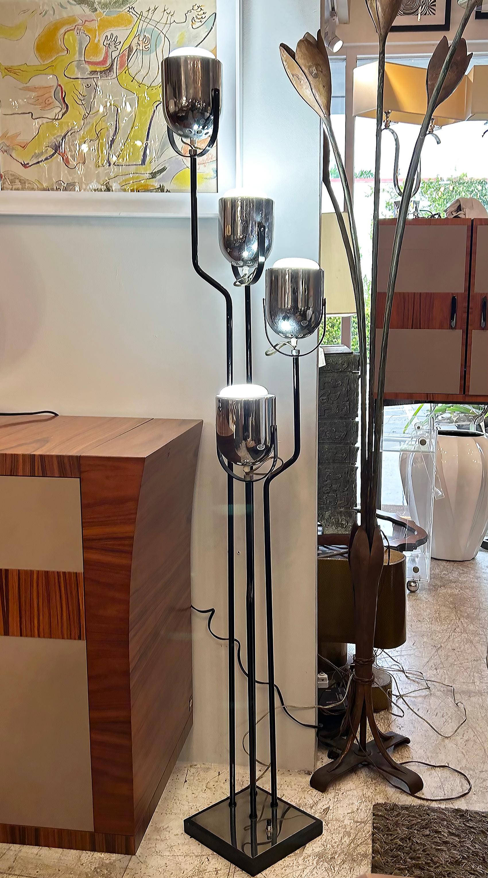  Goffredo Reggiani Italian Floor Lamp, 4 Adjustable, Pivoting Lights

Offered for sale is an Italian floor lamp by Goffredo Reggiani.  This wonderful mid-century modern floor lamp is raised on a square chrome and iron base which measures 8 1/4