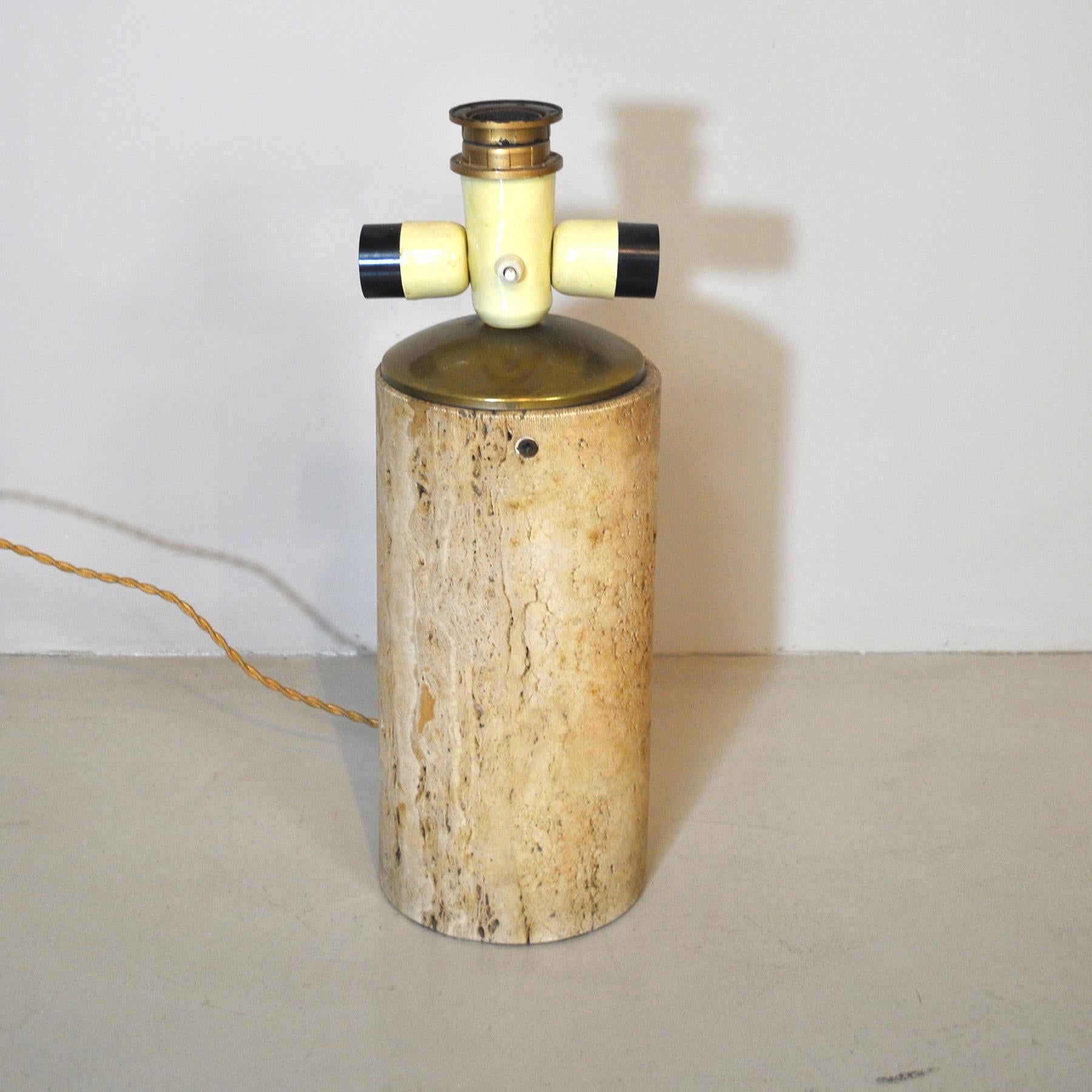 Amazing table lamp by Goffredo Reggiani in travertine marble from the 1960s.
The lamp is sold without the lampshade in the picture, but it can be requested in the form, sizes and colors at will with an extra price.