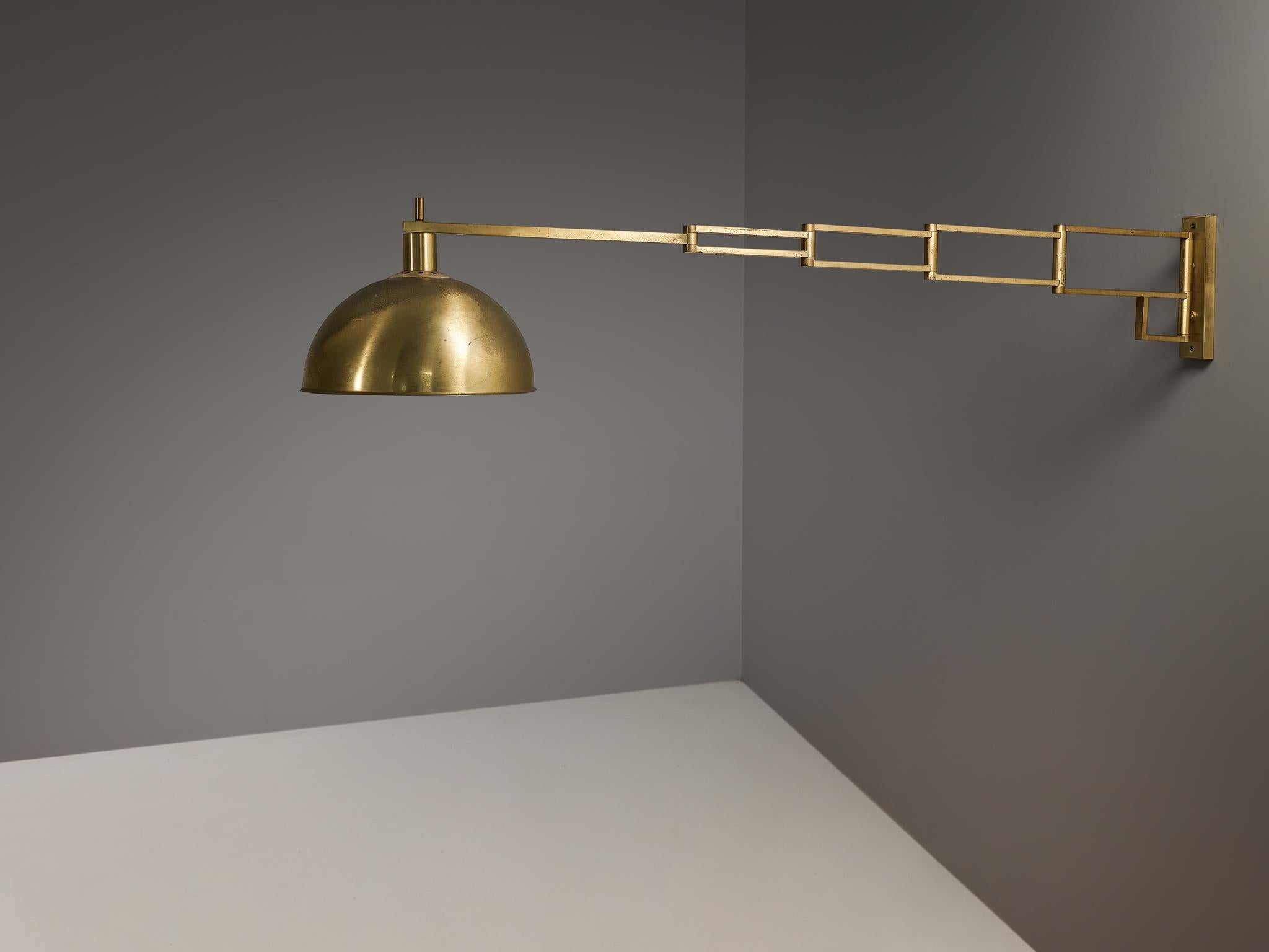 Goffredo Reggiani, wall light, brass, Italy, 1960s

Not only is this lamp aesthetically pleasing, functionality plays a role in this design noticeable in the extendable arm which allows you to change the position of the shade. Hence, the light