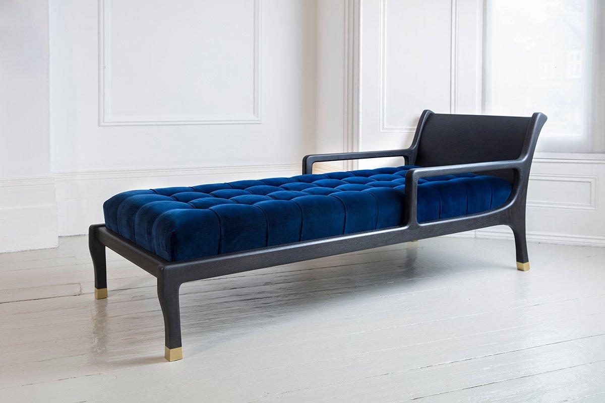 A hand carved chaise longue with a hand applied finish creating the blackened oak frame. Stunningly combined with cotton velvet buttoned upholstery and solid brass socks. 

This unique piece oozes timeless elegance.

Available in the cotton