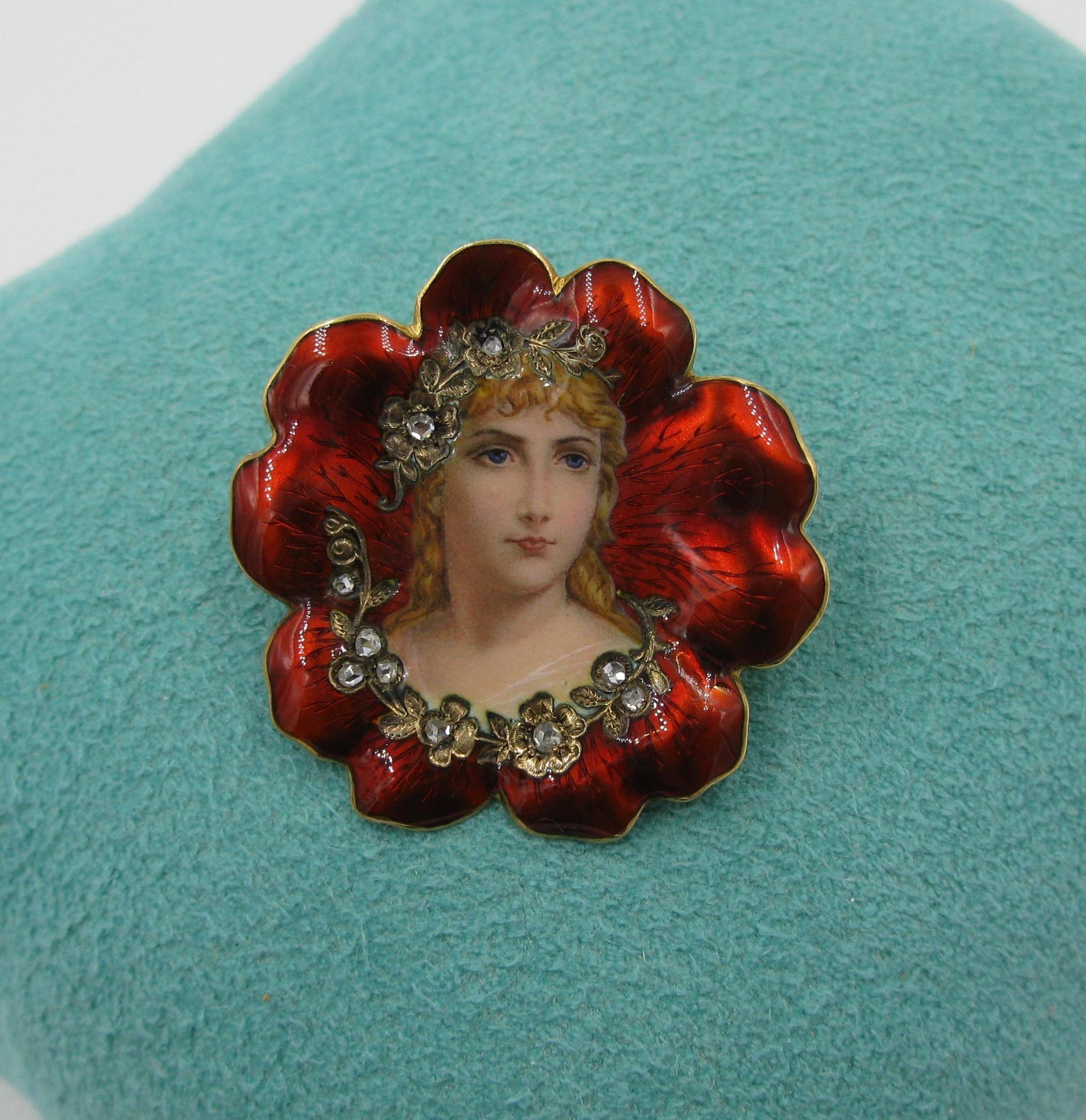 This is a spectacular flower maiden brooch in enamel with rose cut diamonds in 18 Karat gold by Golay & Fils of Geneva, Switzerland.   A beautiful maiden is set within a vivid red flower.  Around her is a garland of flowers set with rose cut