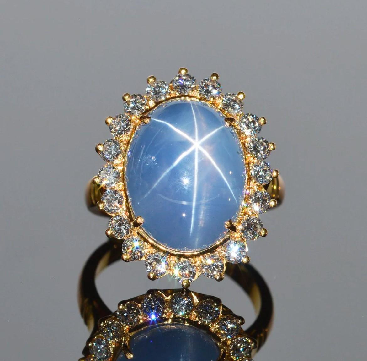 The awe-inspiring Golconda Star Sapphire is a stunner! It weighs a sizable 21.70 carats and is framed by 22 diamonds in 18k yellow gold halo. Without a doubt one of the most beautiful star sapphires available. The dimensions of the ring are 22mm x