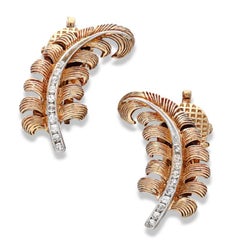 A 0.12 Cts Gold and Diamond Feather Earclips