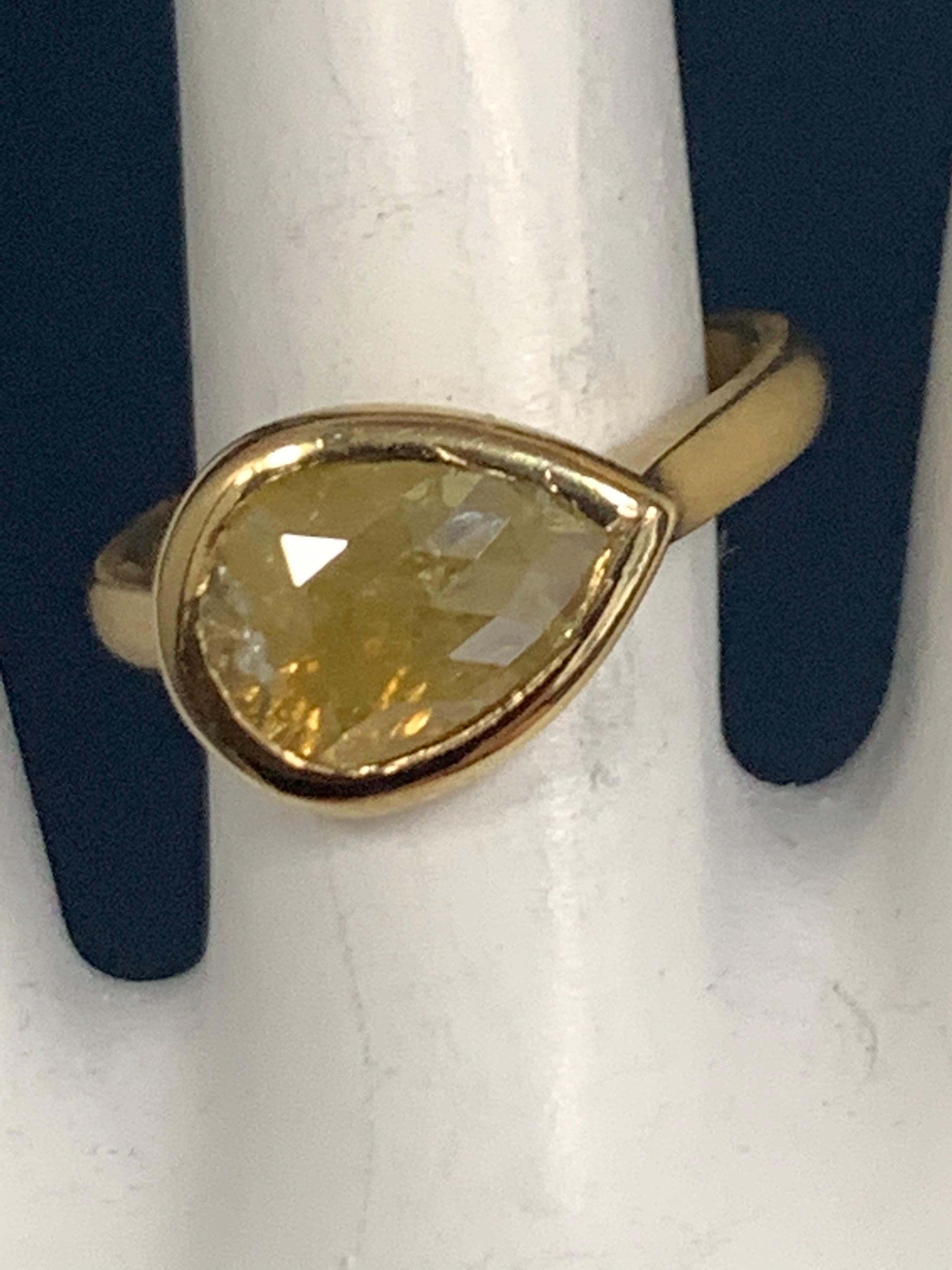 A stunning 18k yellow gold cocktail ring (matte finish) set with a 1.27 carat pear shaped rose cut natural brownish Yellow diamond measuring approximately 12x8mm. 

The weight of the ring is 4.5 grams, ring size is 4.75. 
