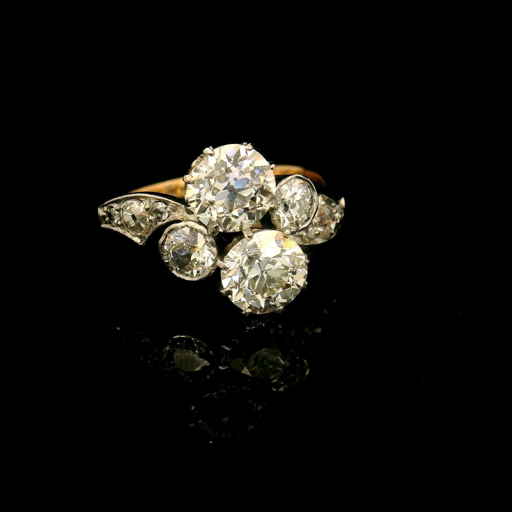 Antique Toi & Moi (You and Me) diamond Ring circa 1900. 

Ring set with two main old European cut diamonds of approximately 1.00 and 0.95 Carats (estimated H color and Vs / Si clarity).  

Two old European cut diamonds for a total of approximately