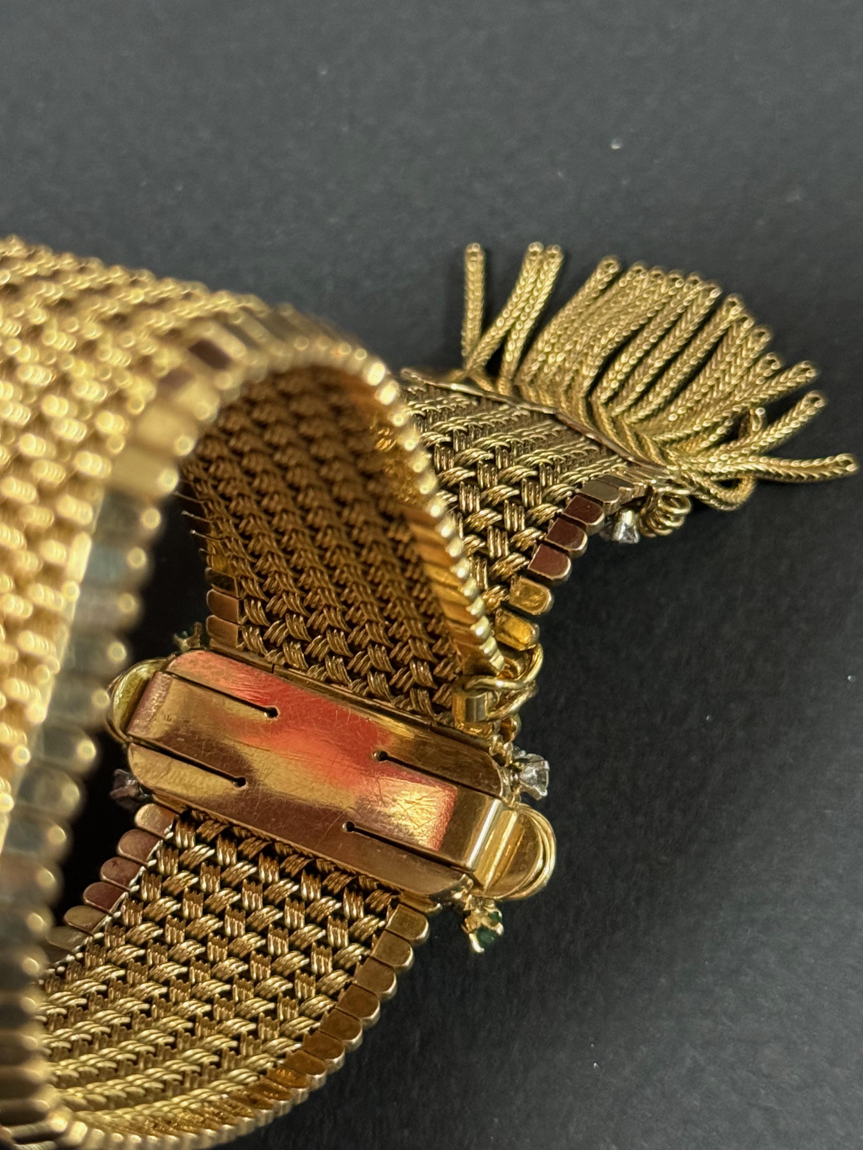 Wonderful 18k yellow gold, diamond and emerald bracelet from circa 1930-50. This elegant and belt like bracelet is perfect for an evening night out but can also be worn everyday.

Gold flat mesh, with a clip clasp. The clasp is adorned with diamond