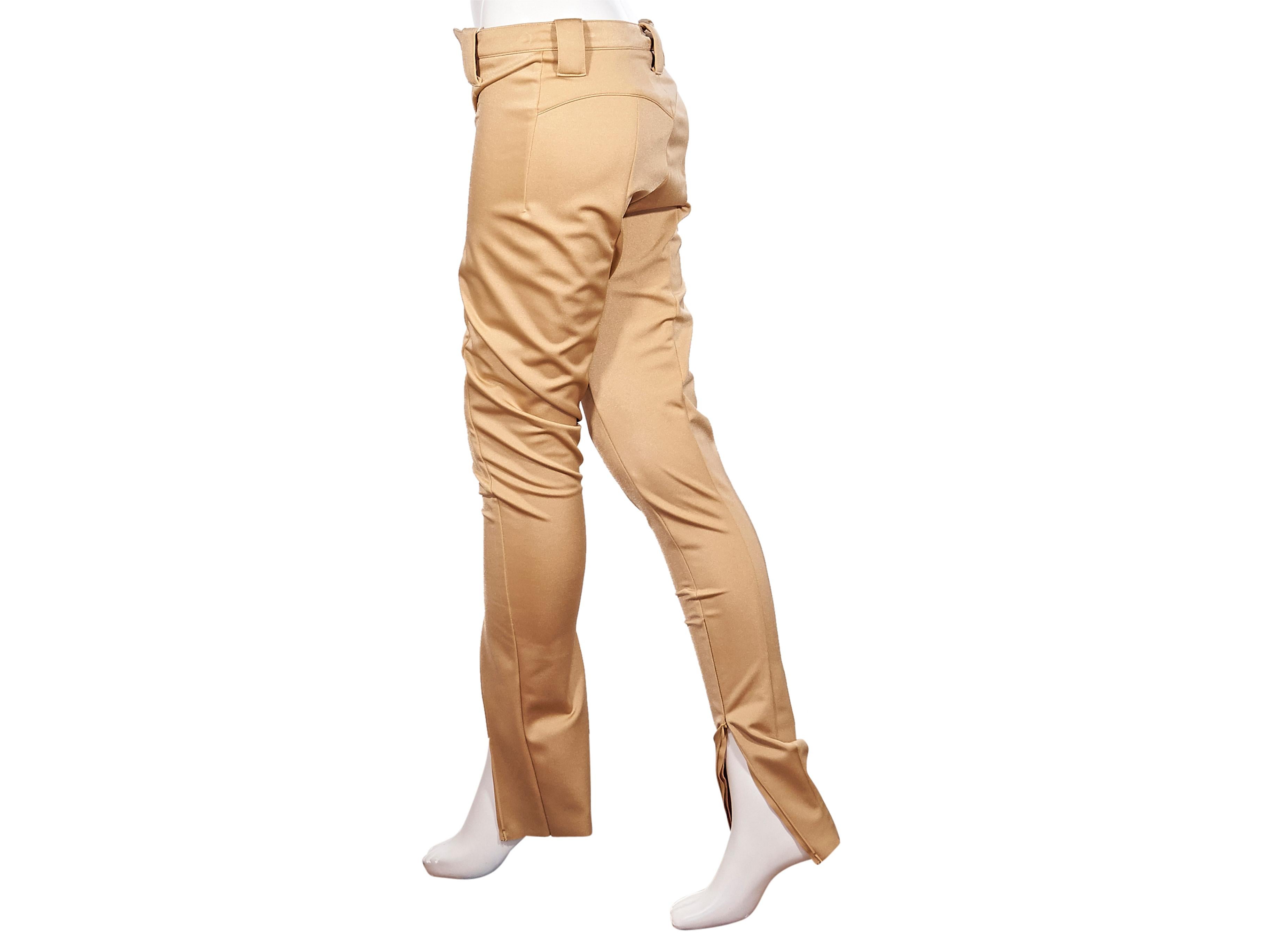 Product details: Gold stretch-crepe skinny pants by Balenciaga. From 2016 Collection. High-waist. Belt loops. Button and concealed zip front closure. Zip closures at ankles. Style with platform sandals. Includes tags. Label size FR 36. 29