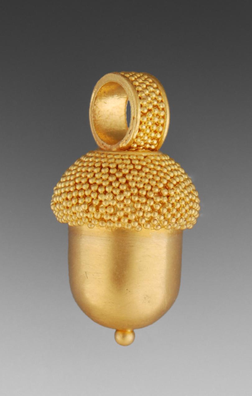 In antiquity the oak tree was considered a powerful life affirming symbol and so is the acorn. Because the acorn grows only on fully mature trees, it was also considered a symbol of patience in attaining one's goals. This gold acorn in 22 karat gold