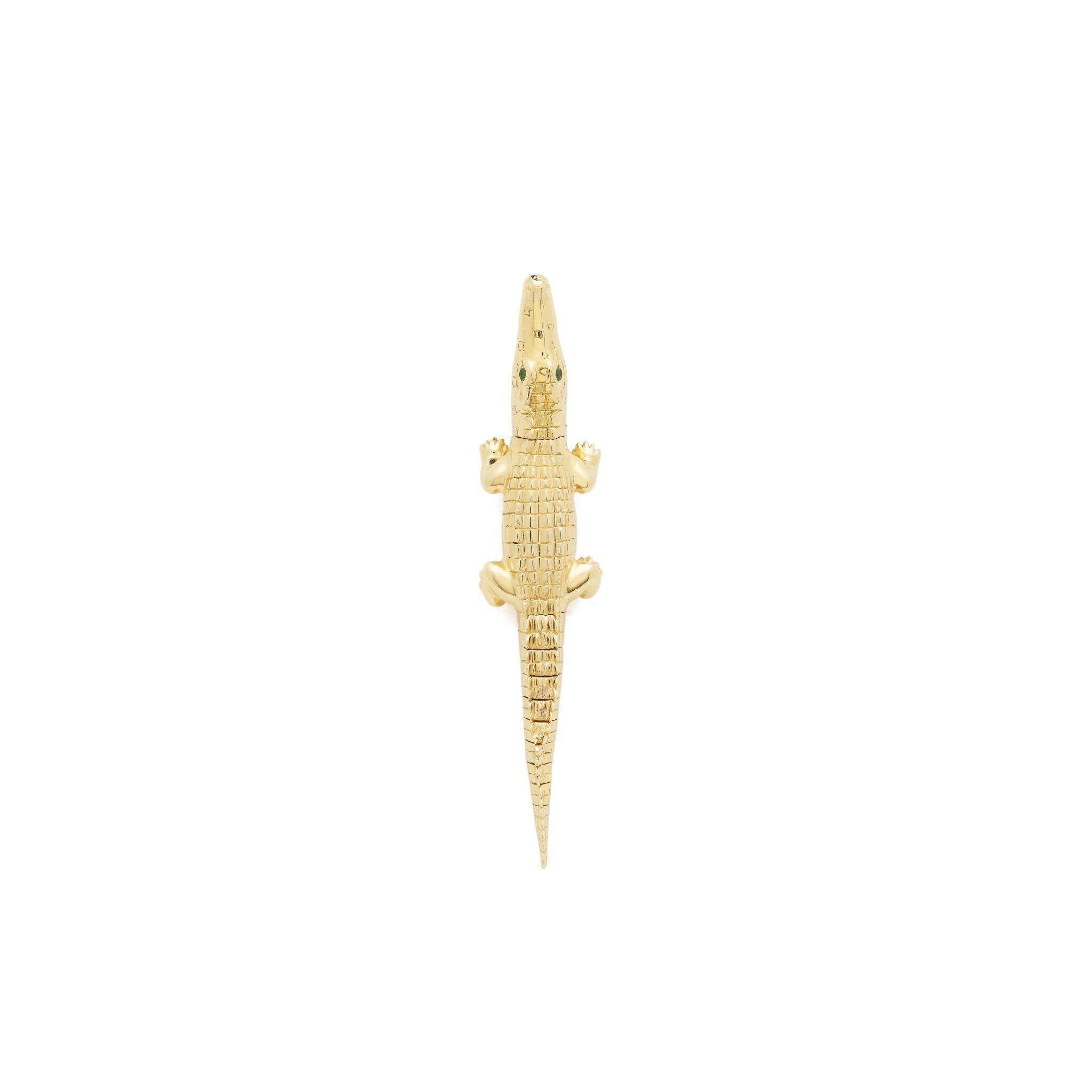 Intricately carved and hand-crafted to replicate an alligator’s body in miniature. These earrings are designed in 18k yellow gold with the alligator’s mouth acting as the earrings’ closing bite mechanism to snap onto the ear. With tsavorite eyes,