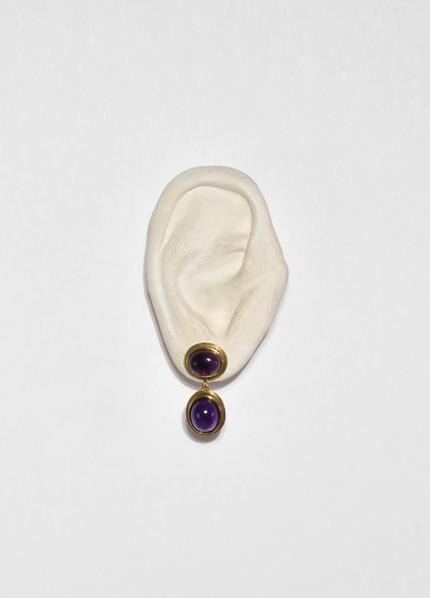 Vintage gold earrings with polished amethyst dome cabochons, pierced. Stamped MMA.

Material: 14k gold plate, amethyst.