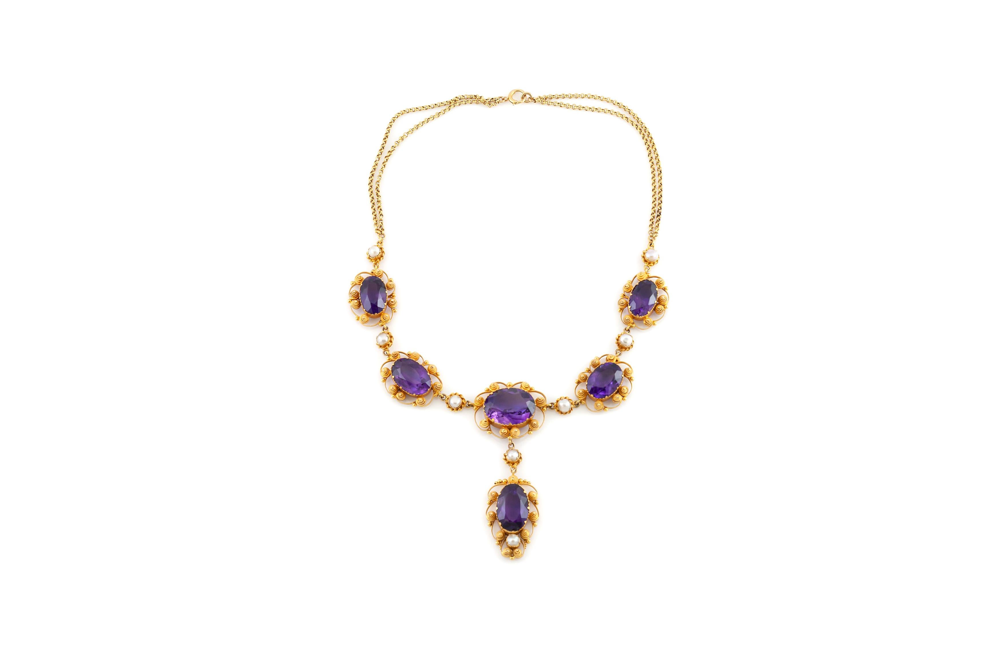 Finely crafted in 9k yellow gold.
The necklace features six Oval shaped Amethysts weighing approximately a total of 57.00 carats, the drop is detachable.
The earrings features two Oval and two Pear Shaped Amethysts weighing approximately a total of