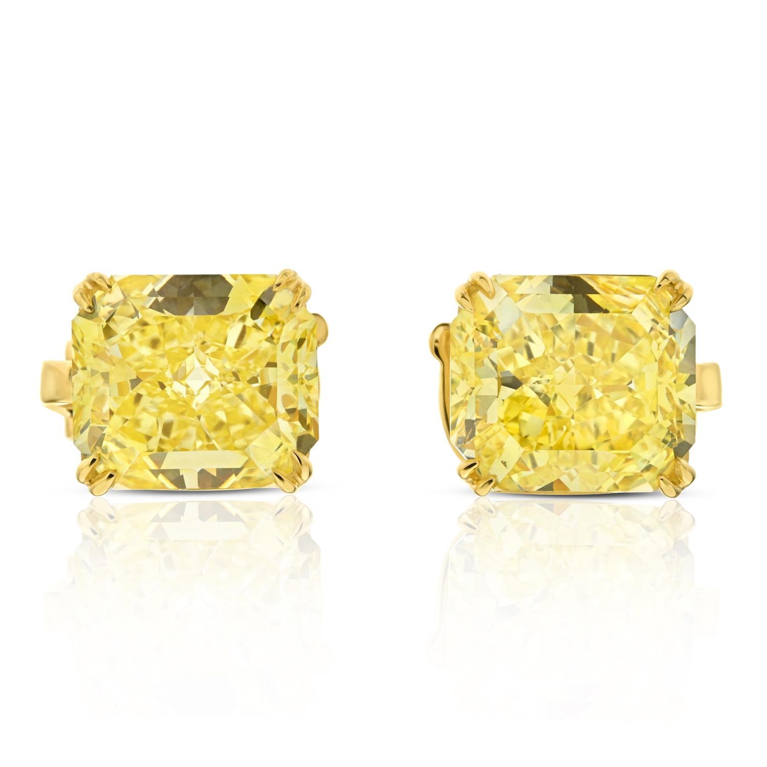 Each centering a radiant cut Fancy Intense Yellow Diamond.

Unique fancy yellow intense diamond stud earrings of 6 carat each, GIA certified VS2 and VVS1 clarity matching diamonds. Diamonds weighing a total of 12.09 carats.

A truly stunning pair of