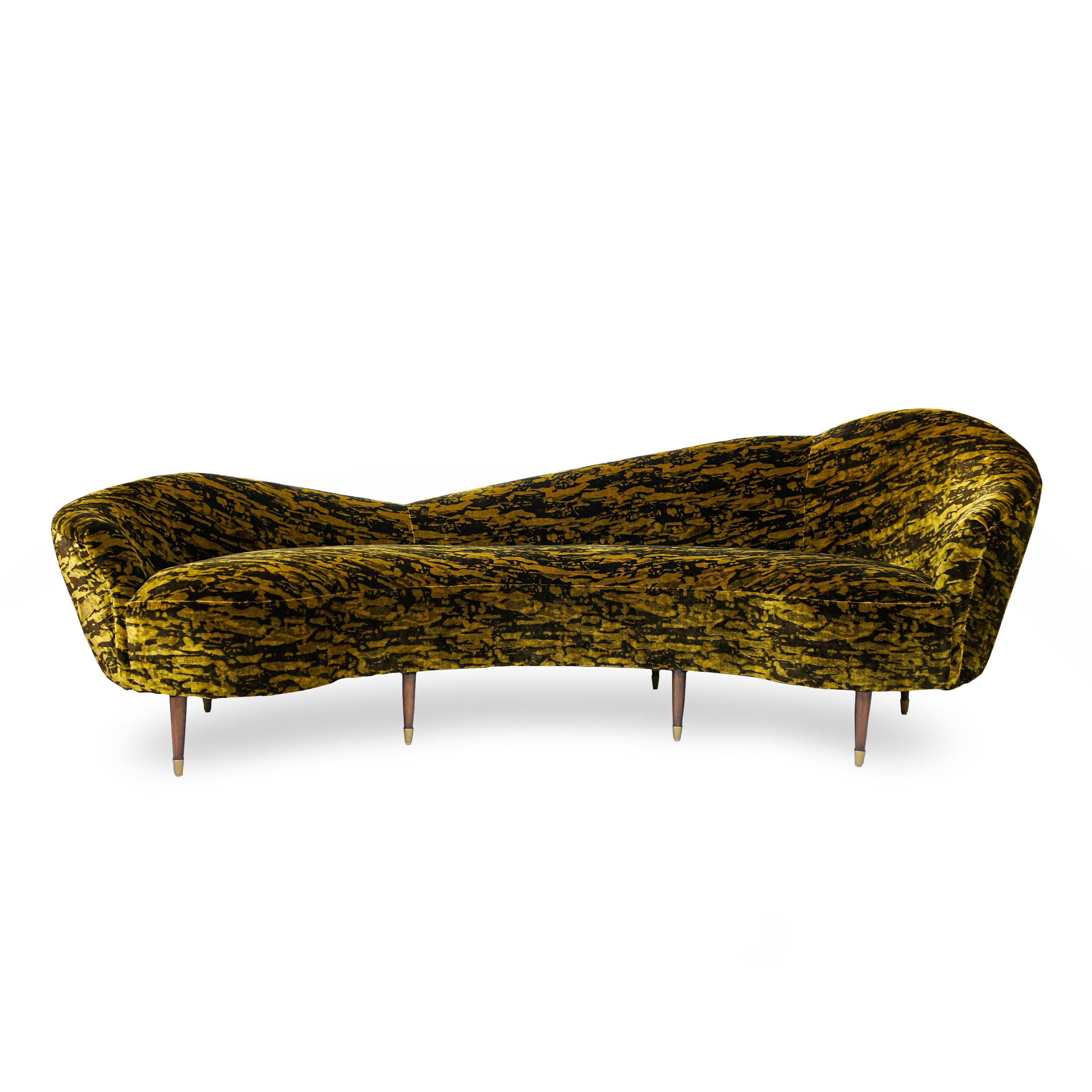 Sleek tight back sofa with sinuous curves. Silky tiger eye velvet covers a solid maple frame with a firm seat made with 8-way hand tied springs. Tapered legs are made in wenge with brass tips. Can be customized in size, fabric and wood finish. Ask