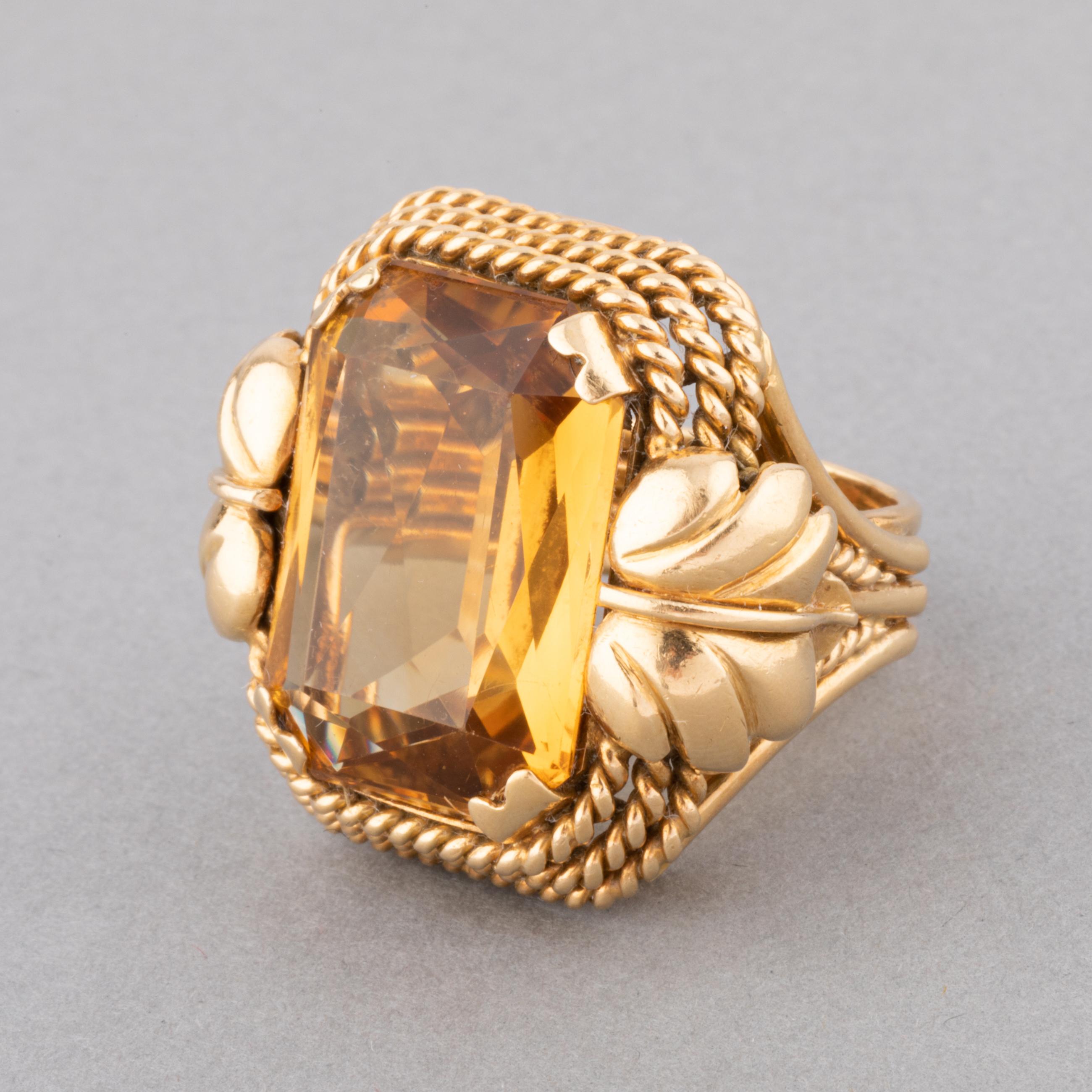 A lovely retro ring, made in France circa 1955.
Made in yellow gold 18k, it is big model. The front part measures 27 and 26 mm. 
The citrine weights approximately 15 carats.
Ring size is 50 or 5.25 USA, possible yo resize some.
Total weight 18.20