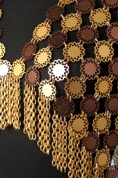 Gold and copper metal vest with gold metal fringes