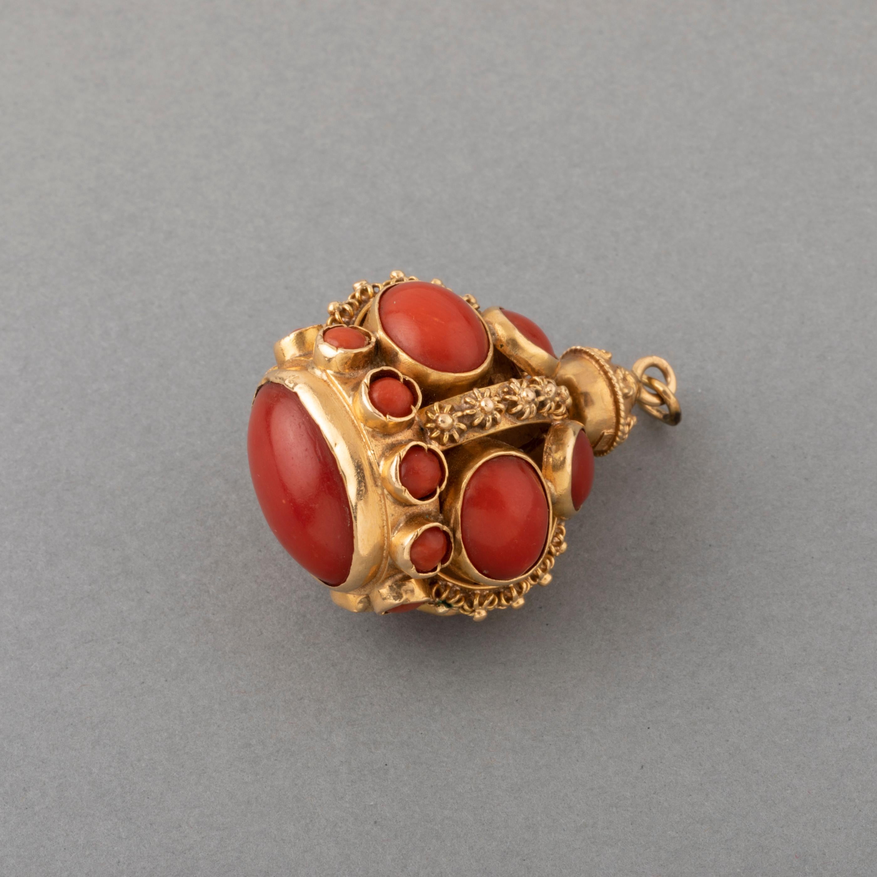 Gold and Coral Vintage Charm

Very beautiful charm, made in Italy circa 1960.
Made in yellow gold 18k (mark for gold).
The condition is good.
Set with mediterranean  red coral. The coral a intense color, is is quality.
Dimensions: 3.5*2.6 cm 
Total