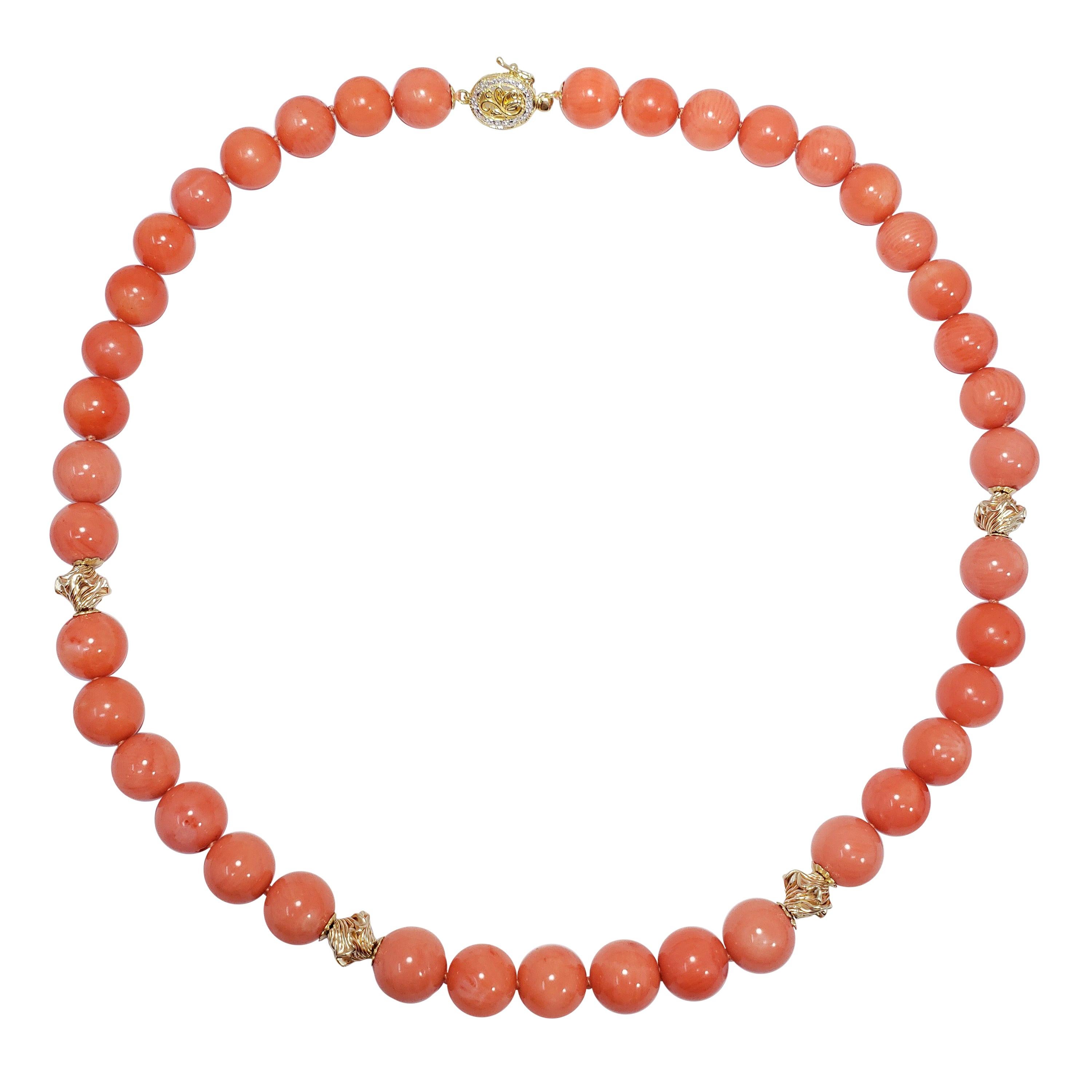 Gold and Diamond Accented Salmon Coral Bead Knotted String Necklace, 14 Karat For Sale