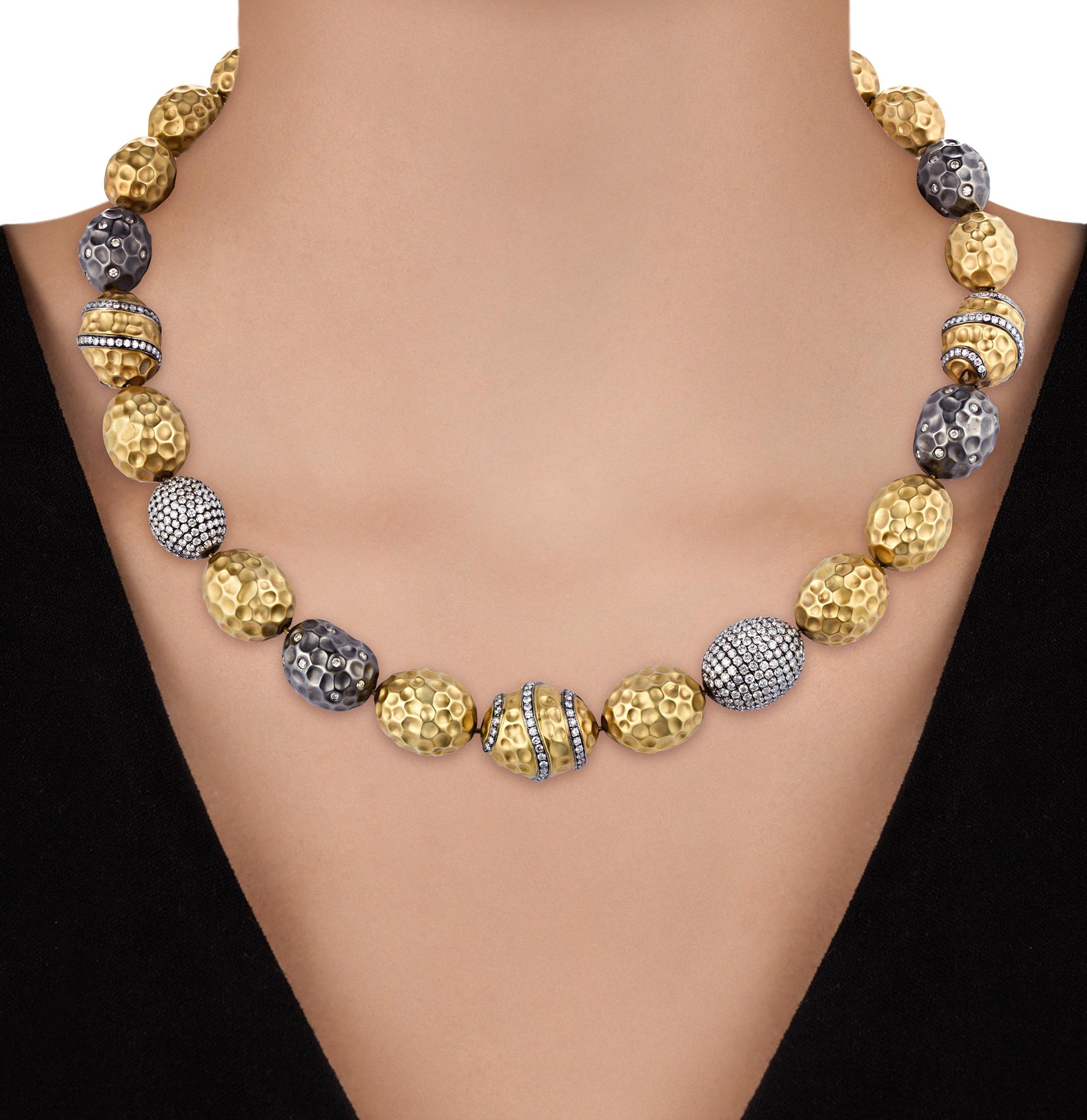 This exquisite hammered 18k yellow gold necklace exemplifies modern elegance, adorned with 422 pavé set round brilliant cut diamonds. The diamonds, totaling approximately 8.80 carats, are of H-J color and SI1-I1 clarity, offering a captivating