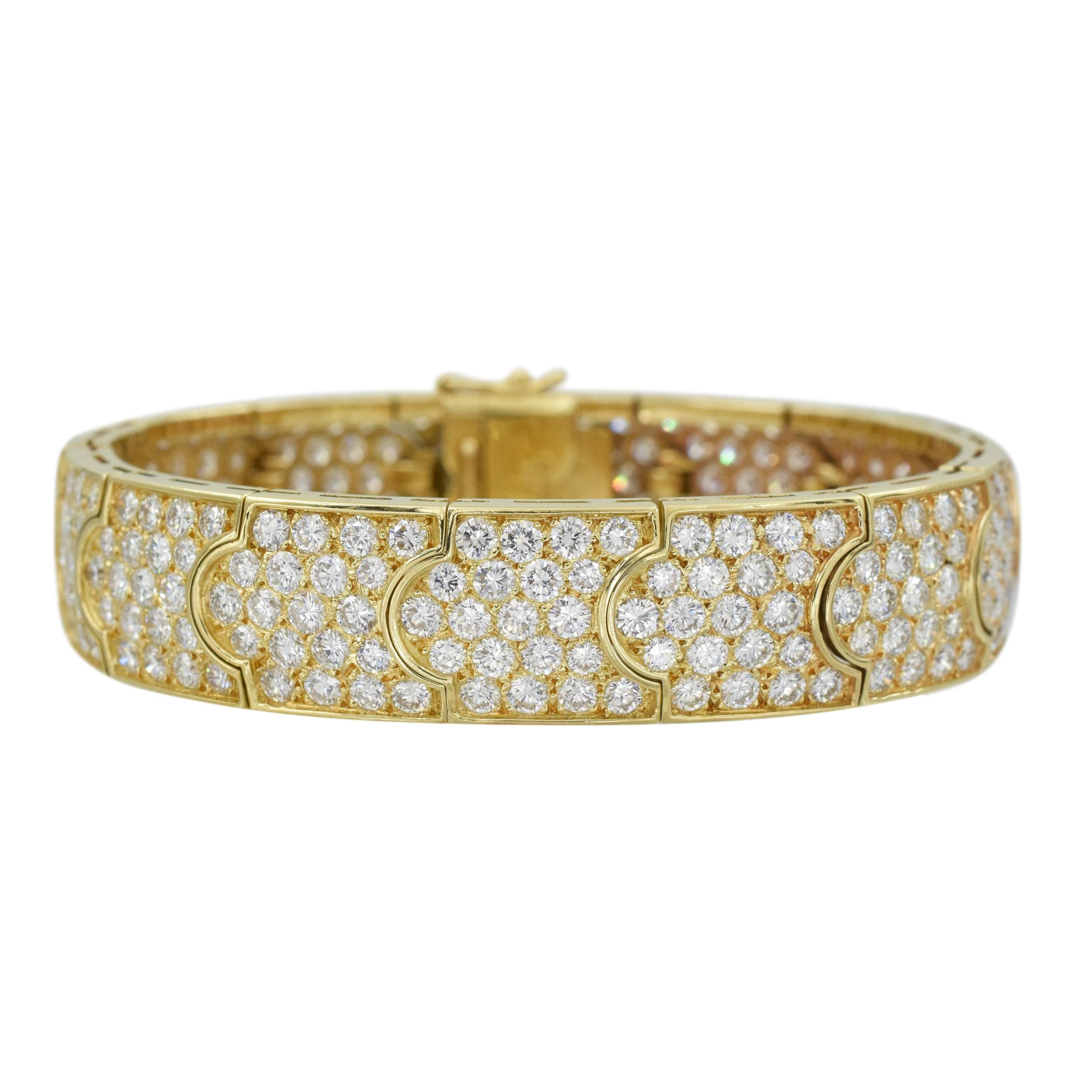 Impressive Gold and Diamond Bracelet This bangle bracelets has 290
diamonds (Color: G/H, Clarity: VS) weight
approximately 22.65 carat  all set in 18k yellow gold.
 Length 7 inches,
 Width: 9/16 inches;


