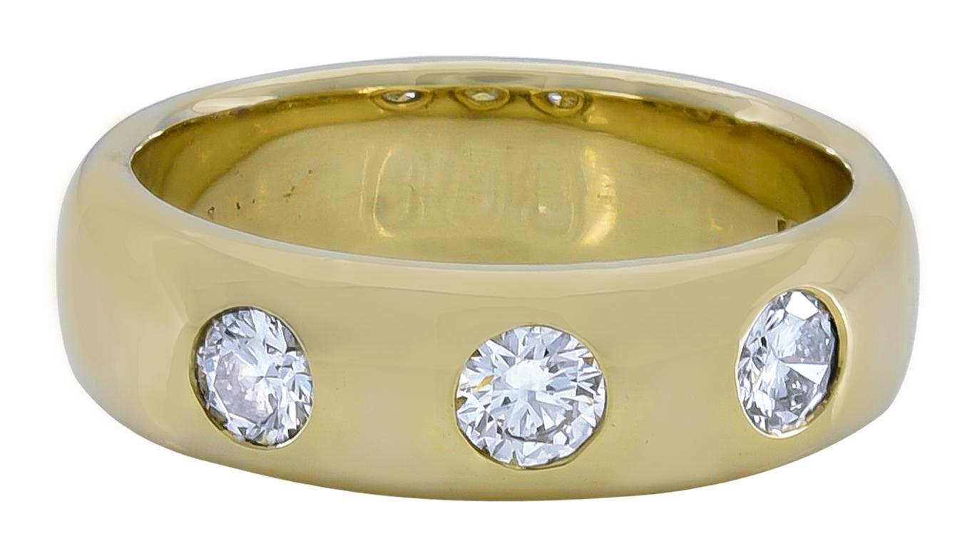 Beautiful three-stone vintage ring.  Made and signed by CARTIER.  Very heavy gauge 14K yellow gold; set with three perfectly matched brilliant diamonds, each approximately .25 ct.  Size 9 1/2 and can be custom-sized.  Outstanding quality and