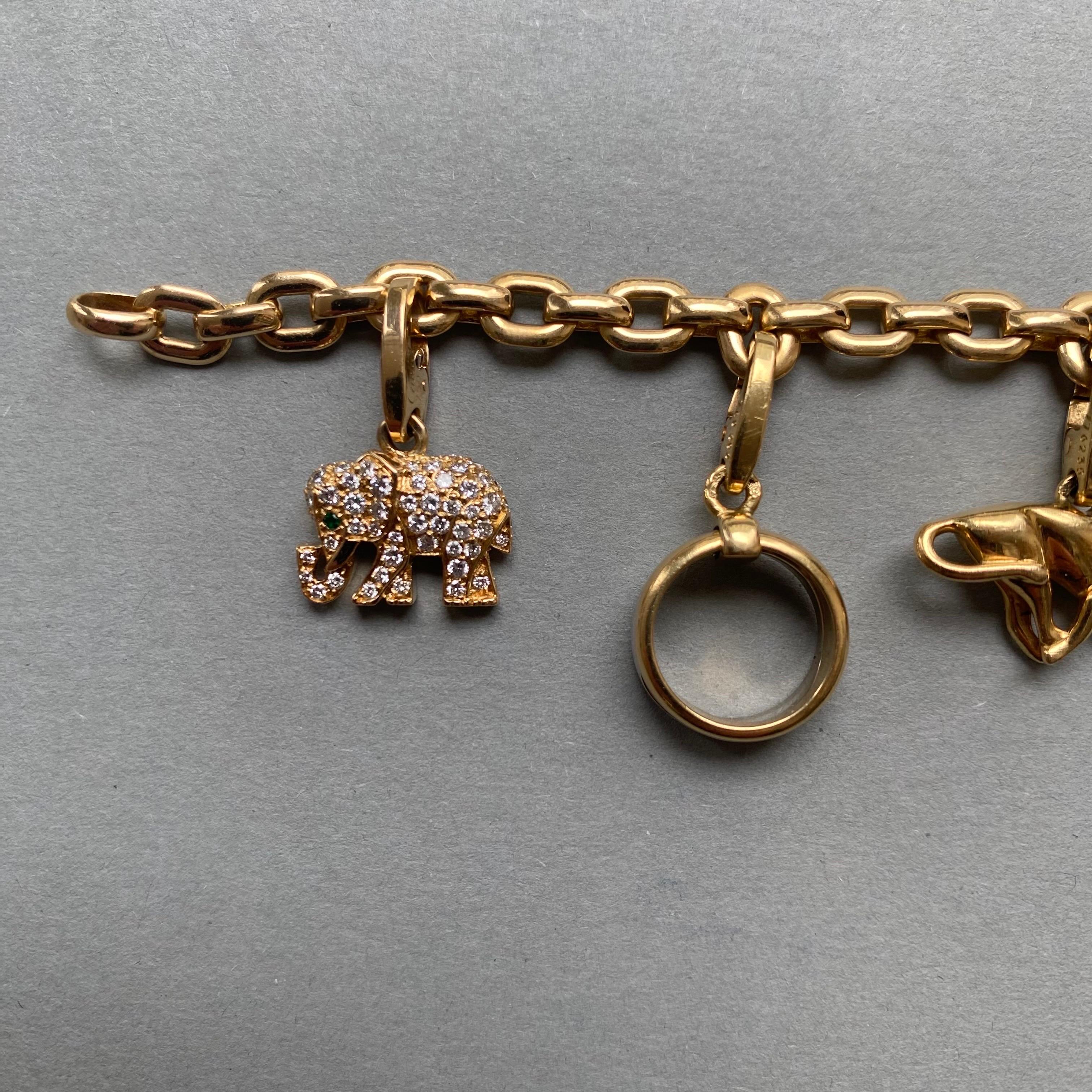 An 18 carat gold Meplat Cartier (signed and numbered) bracelet with 7 detachable signed and numbered Cartier charms (the love charm and the elephant and the bracelet come with their Cartier cetificates.

weight: 42.7 grams
Length: 20 cm