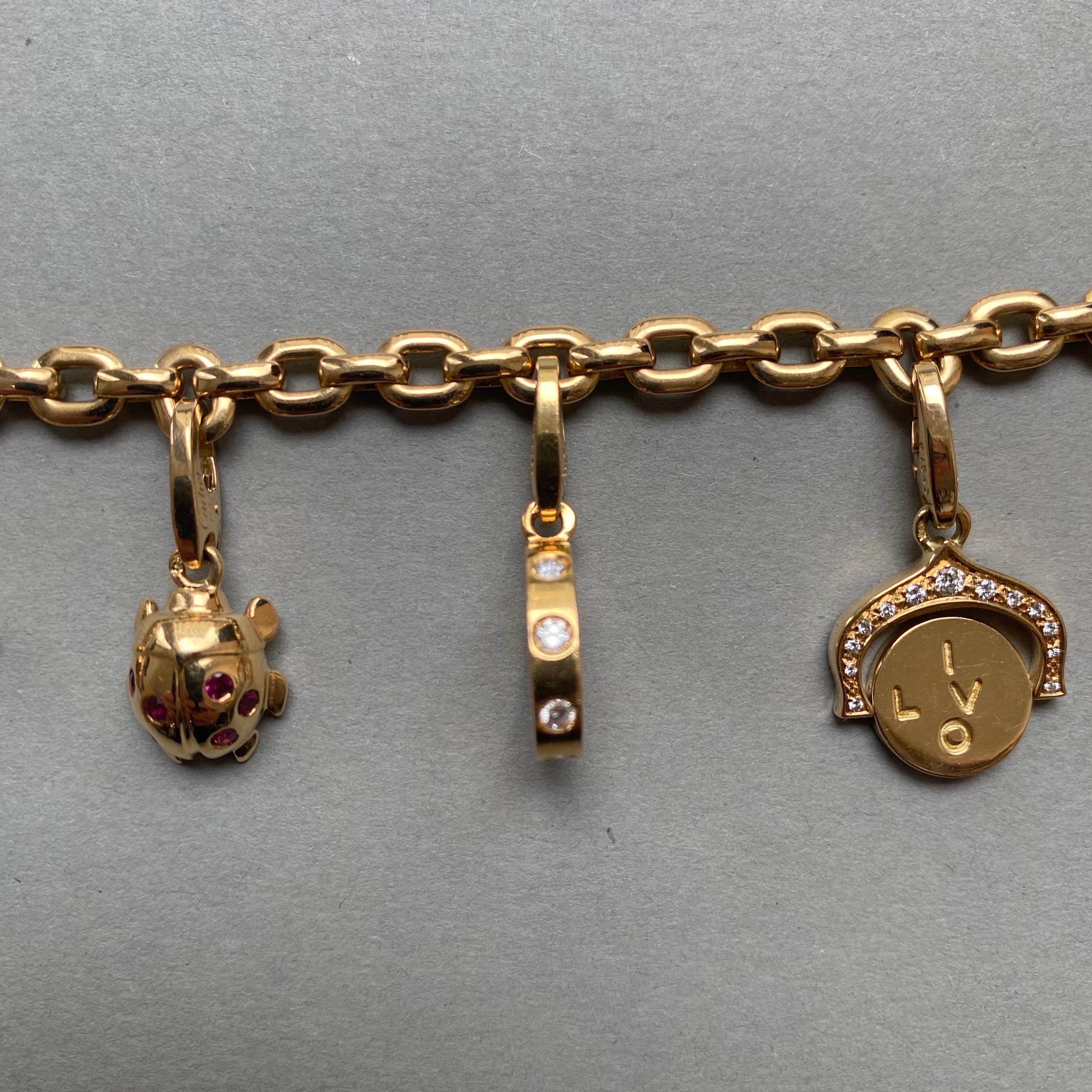 Cartier Bracelet à breloques en or et diamants Bon état à Amsterdam, NL