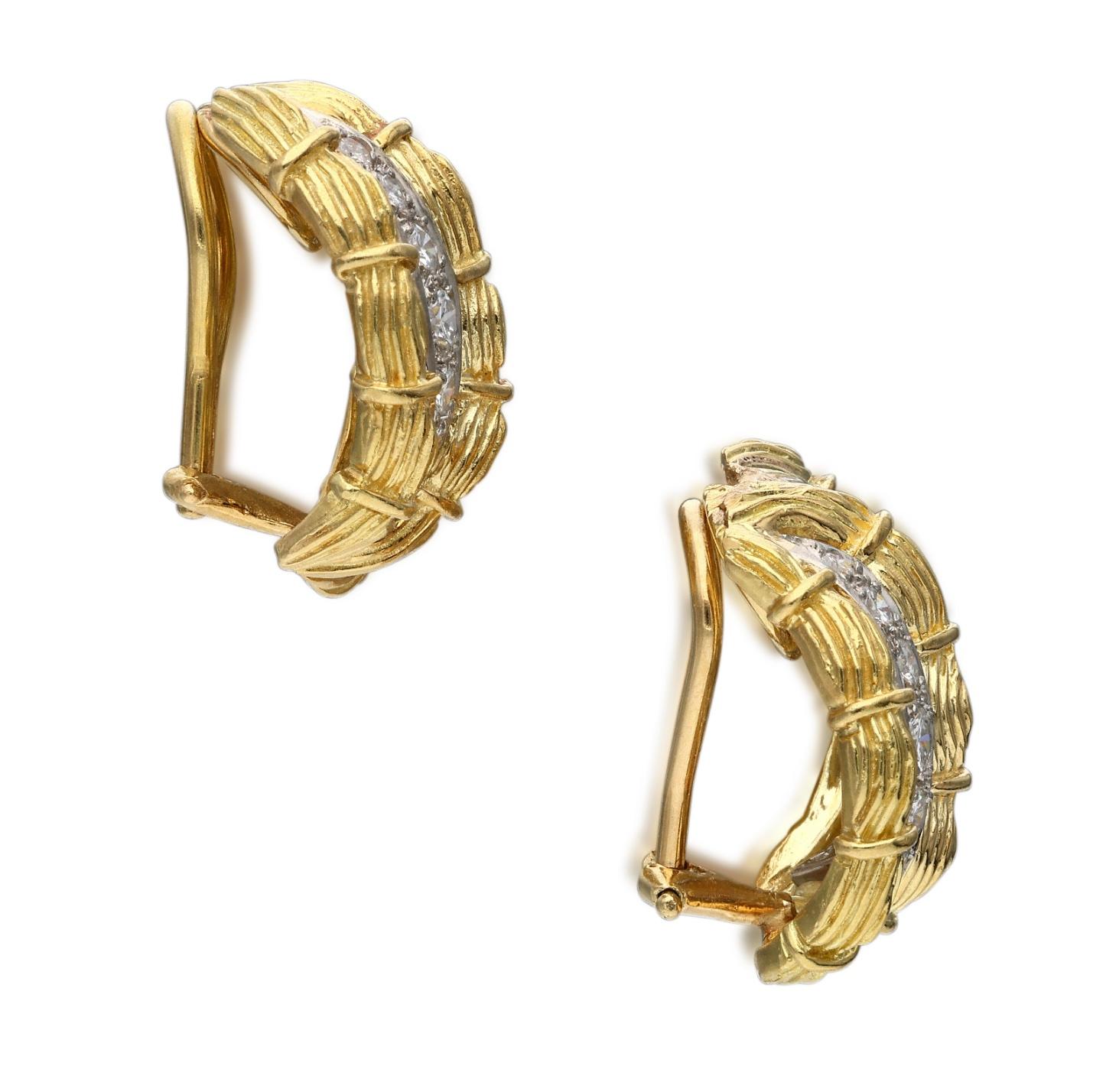 Each clip is composed of two rows of round brilliant cut diamonds, set between three rows of textured gold.
- Diamonds weigh a total of approximately 1.10 carats
- 18 karat yellow gold
- The total weight is 17 grams
- The length is ¾ inch

The