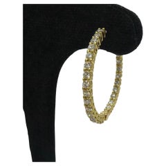 Gold and diamond earrings, 1.04 ct total