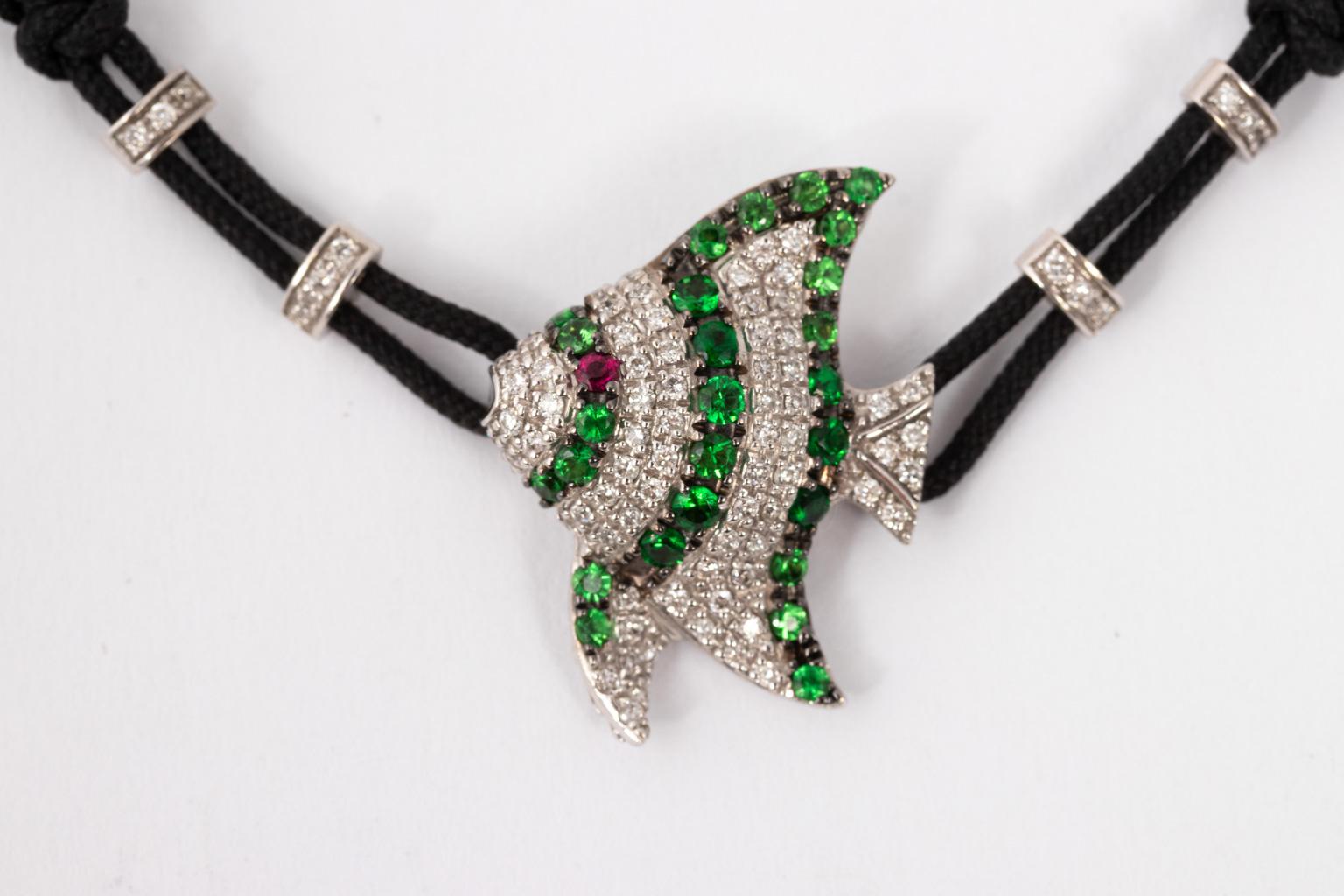 Pull chord bracelet by Pippo Perez, as featured from his sea creature collection. The fish and all accompanying accessories on the bracelet including his name tag are in 18 Karat Gold. The piece also features approximately 80 pts of Diamonds and