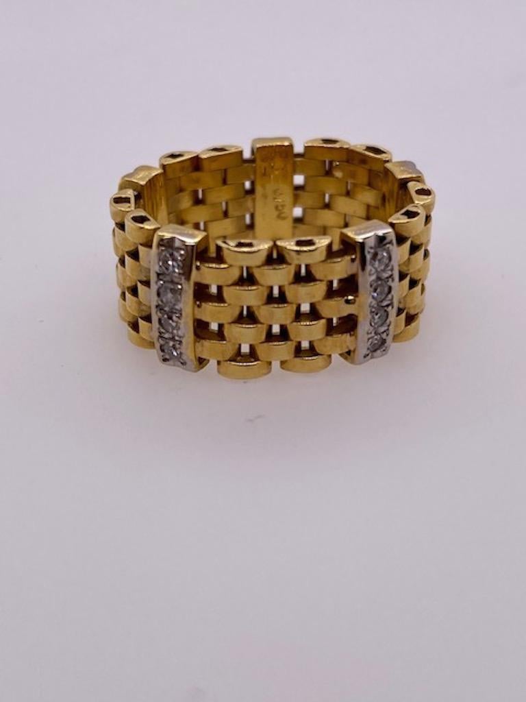 Slim, slinky, silky flexible ring.  Soft 18K yellow gold links hug the finger.  Set with five bars of diamonds, each consisting of four
brilliant-cut diamonds.  Size 8.  3/8