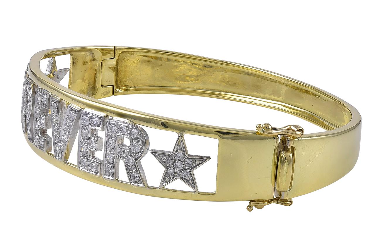Most romantic bangle bracelet.  18K yellow gold, encrusted with cut-out letters that spell out 