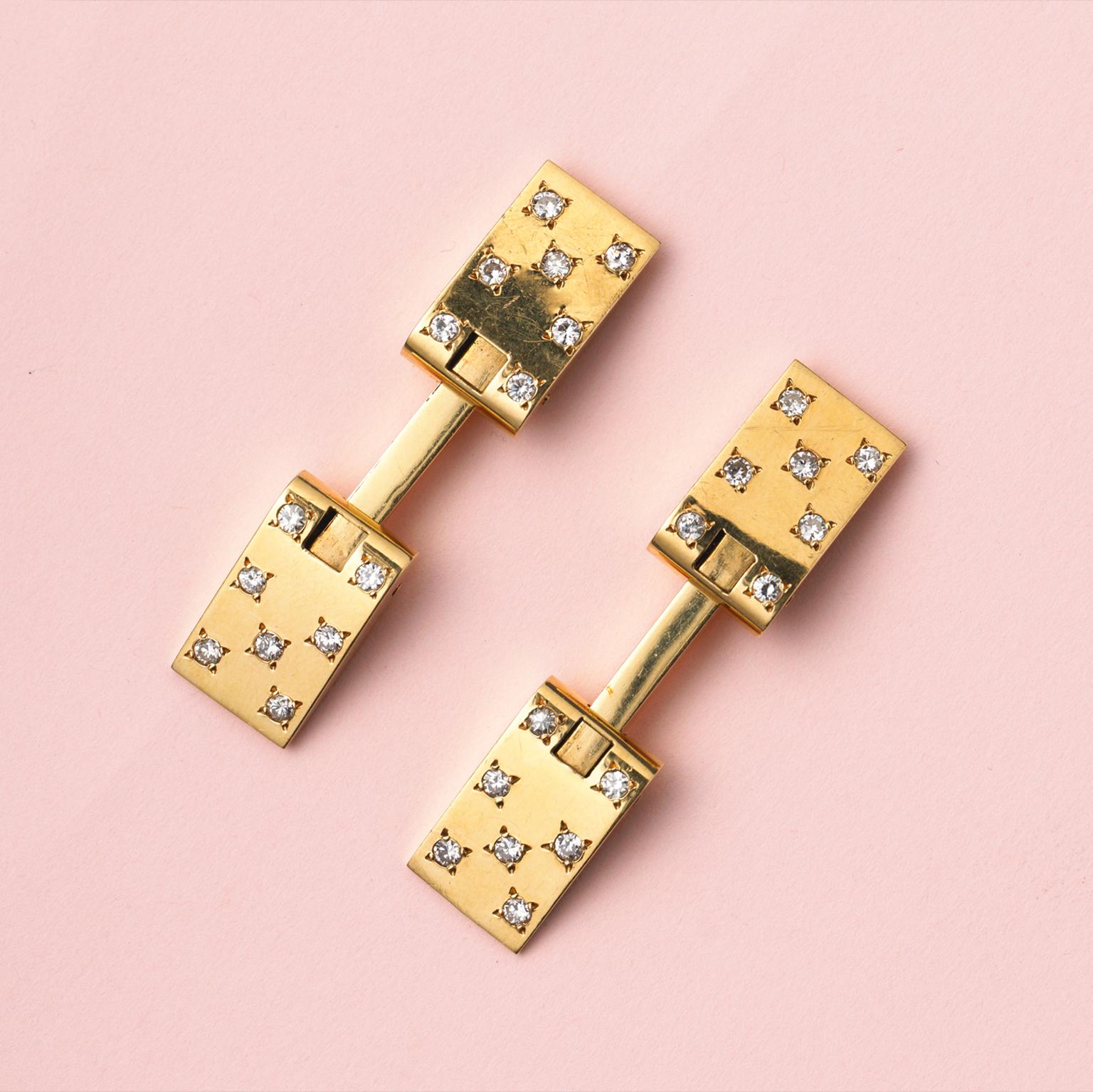 A pair of yellow gold cufflinks set with 14 small brilliant cut diamonds (ap. 1.21 carat in total), France, circa 1960.

weight: 19.97 grams
dimensions: 1.7 x 1.0 cm