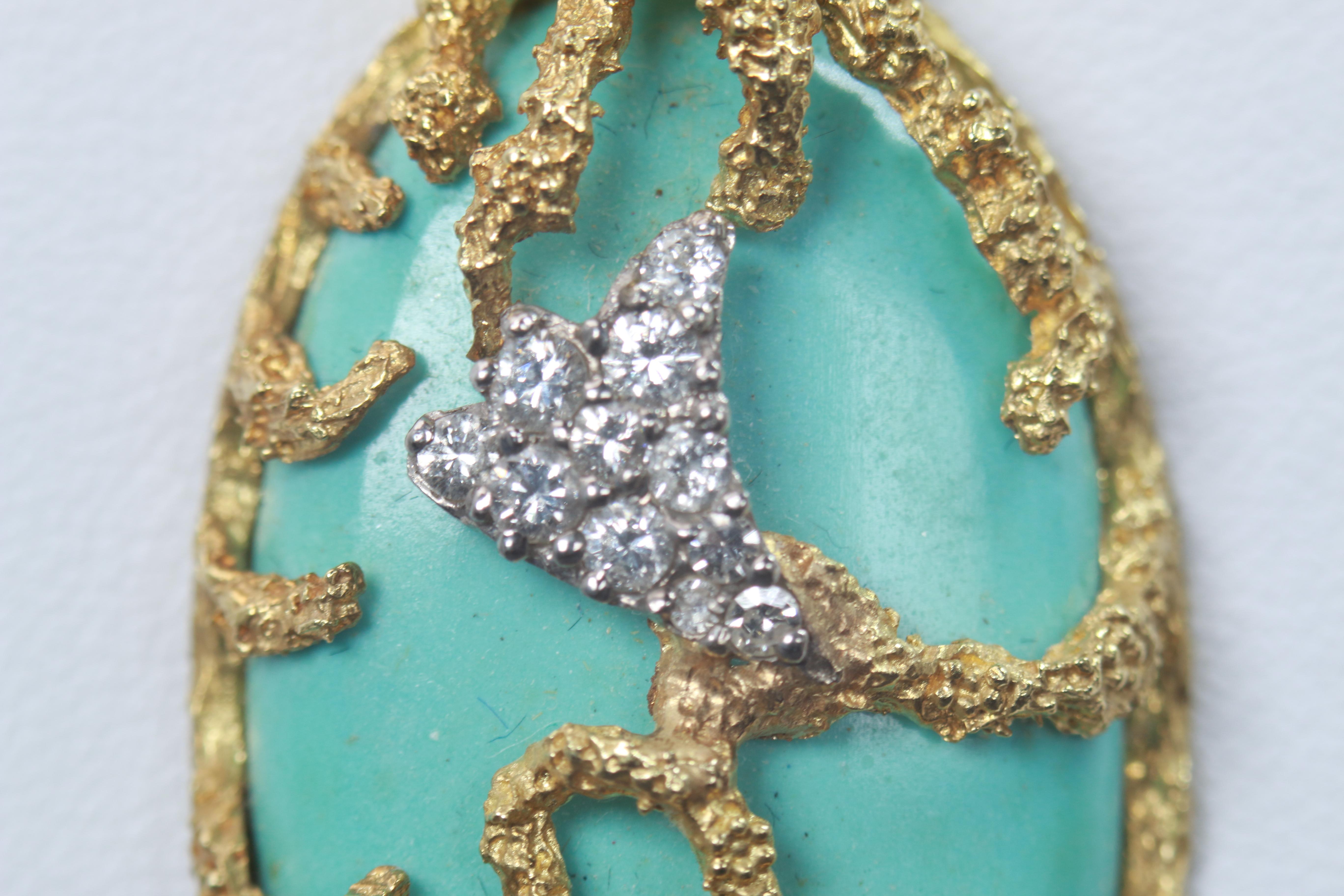 The rarity of this piece can not be understated, a gorgeous turquoise pendant set in 18k yellow gold with diamond embellishments.
