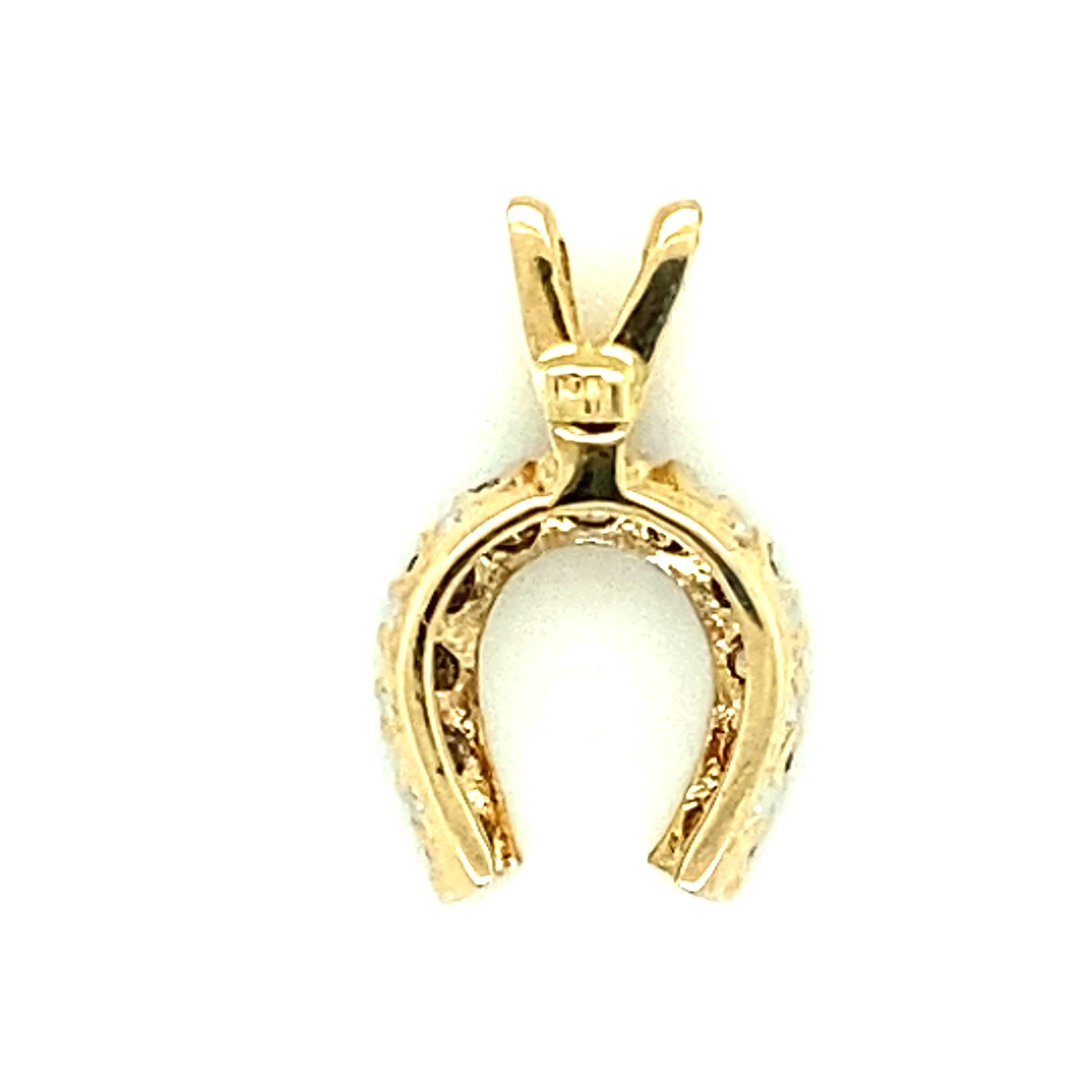 10kt yellow gold charm/pendant in the shape of a lucky horseshoe with approximately .17-.20 carat diamonds. The diamonds are approximately K-L color and I1-I2 clarity. The pendant measures just under .75