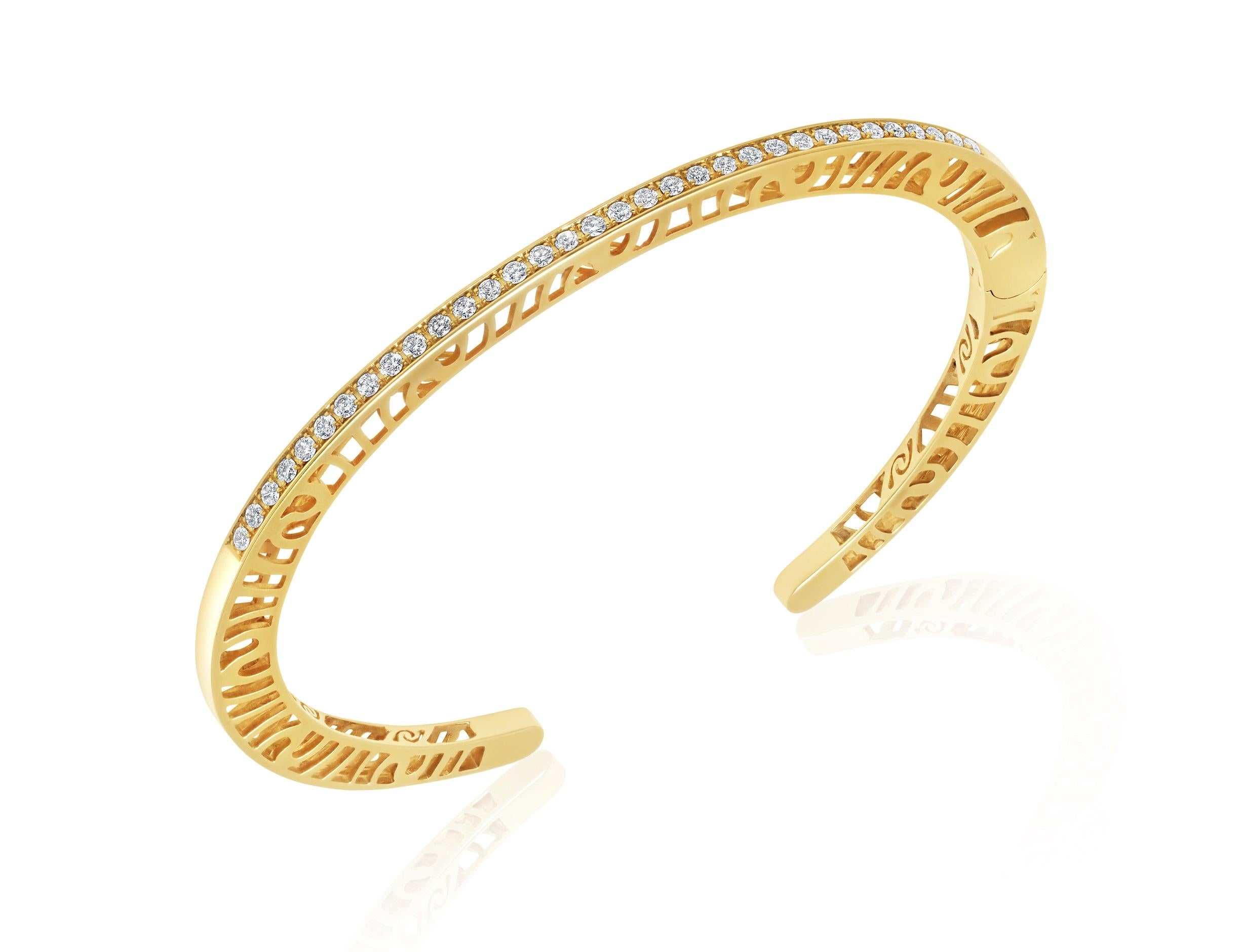 The 3mm wide, 14ky gold and diamond stacking cuff from the Shooting Stars Collection is available for immediate purchase in a size medium. There are 33 diamonds (1.55 mm) that run along the top. Total carat weight is 0.69 cts.  
This cuff  is a