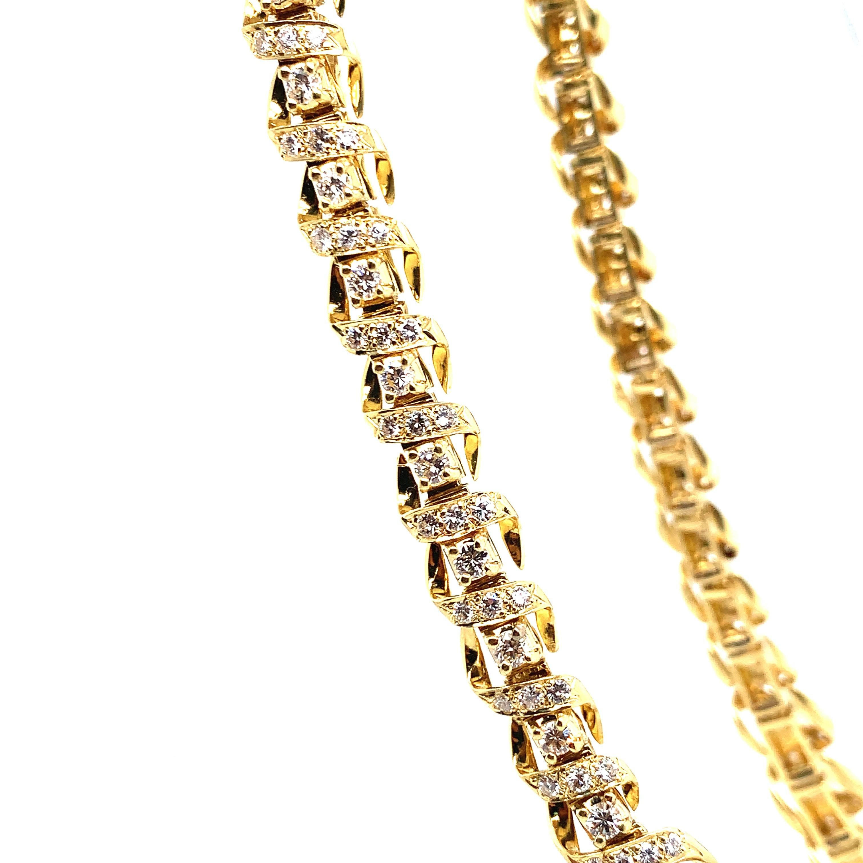 An elegant necklace consisting of 59 round diamonds that weigh approximately 5.50 carats, and 197 round diamonds that weigh approximately 5.70 carats. Set in yellow gold, this piece weighs a total of 77.7 grams. The length is 16 inches. 

Perfect