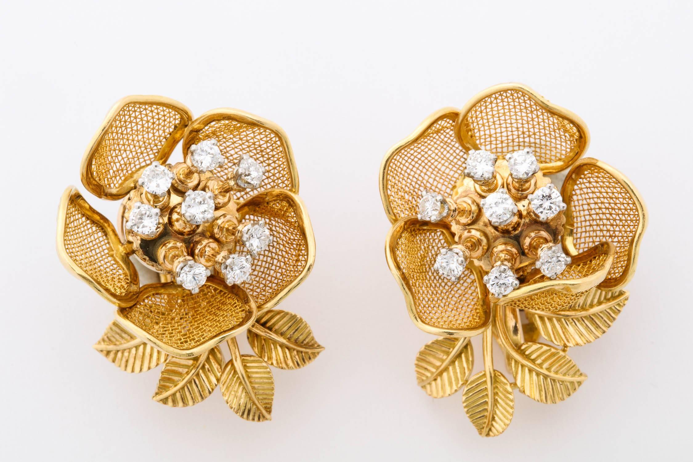 18k yellow gold mesh petals, each petal individually hinged
The brooch features seven movable petals and centers 21  diamonds set in platinum atop gold 