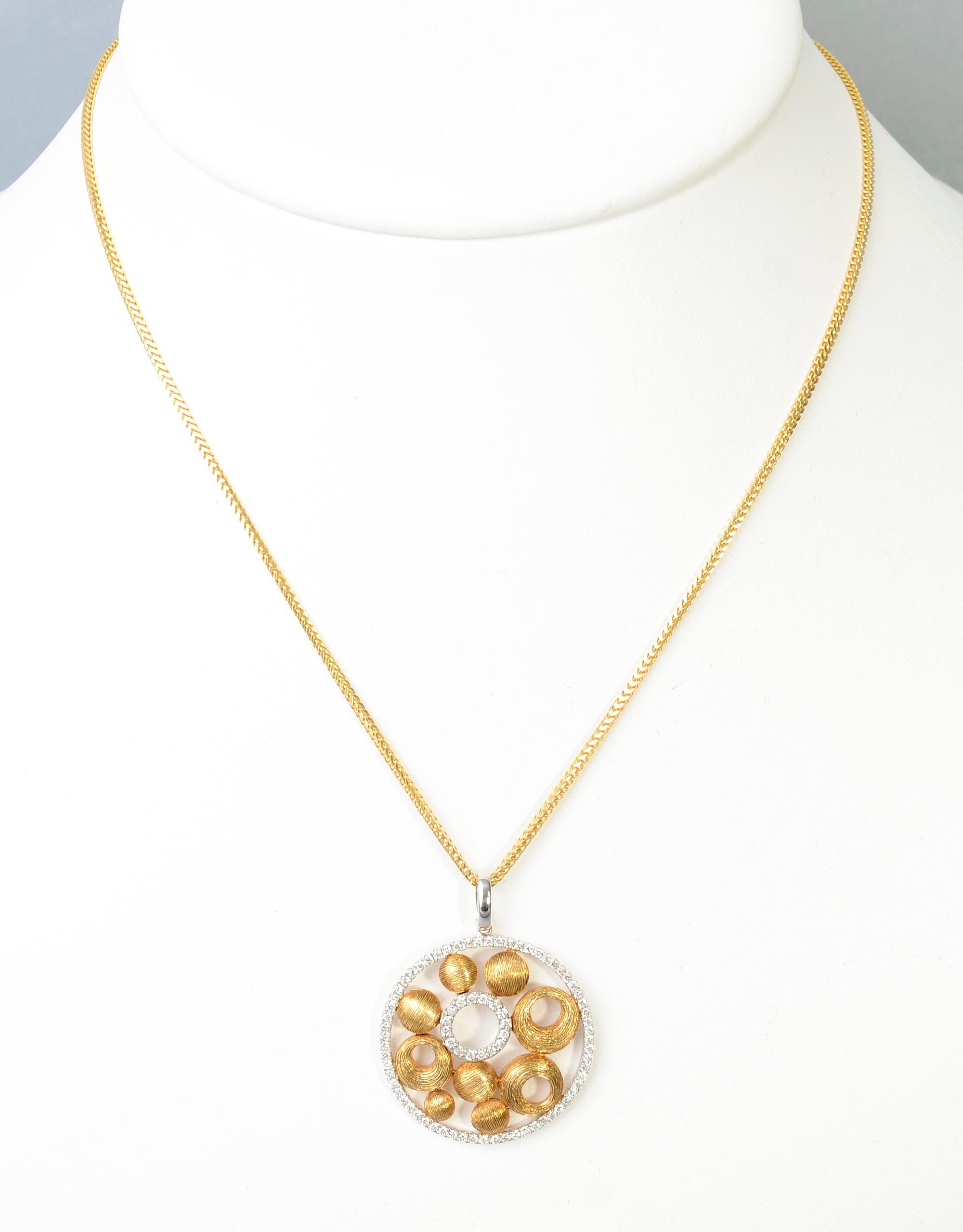 Lovely and unusual 18 karat yellow gold and diamonds pendant necklace. The pendant is 1 1/15